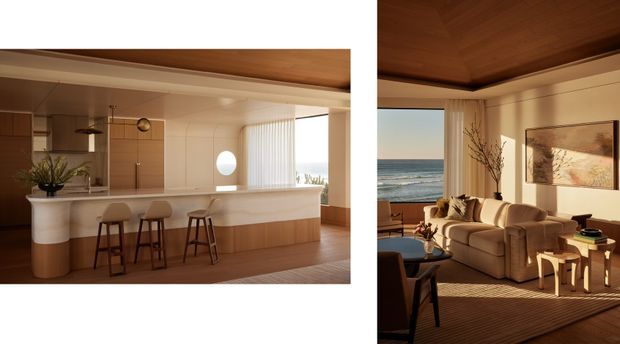Diptych showing a warm, refined open-plan coastal interior. The left panel features a contemporary kitchen with a long curved island and integrated raised seating, pale cabinetry, timber flooring, and a timber-lined ceiling. The right panel shows an adjacent living room with a large upholstered sofa, timber ceiling, framed artwork, side tables, and expansive ocean-facing glazing. Strong horizontal composition, natural daylight, and warm neutral materials create an inviting beachside atmosphere.