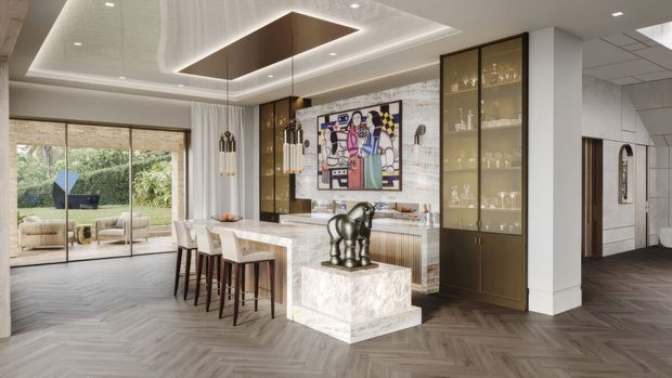 A refined open-plan dining and living area with a sculptural kitchen or bar island, marble-look surfaces, dark timber cabinetry, fluted glass display joinery, and a large abstract artwork. The space features herringbone timber flooring, layered recessed and pendant lighting, a textured light stone or brick feature wall, and full-height glazing opening to a landscaped outdoor area. A hallway and additional rooms are visible to the right.