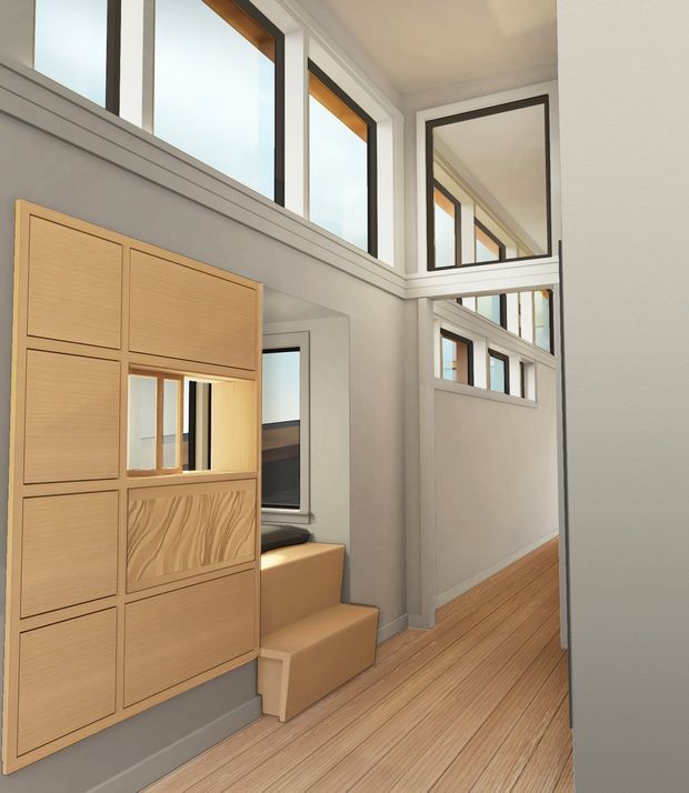 Bright contemporary interior hallway with a compact timber-clad stair and integrated storage wall. The space features extensive high-level glazing and internal windows, white painted walls and trims, dark window frames, and warm light timber flooring and joinery. A large internal mirror reflects the corridor and windows, creating an airy, light-filled atmosphere.