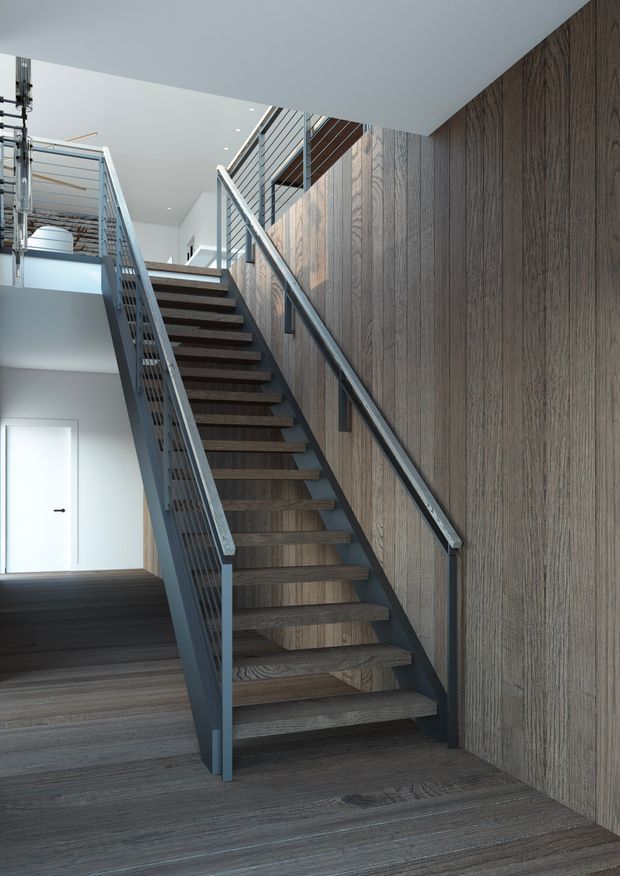 A modern interior stairway with open dark timber treads, grey metal stringers and slim metal balustrades. The stair rises alongside a full-height textured vertical timber feature wall, with a matching dark timber floor and bright white upper-level walls and ceiling. A white door and glimpses of an upper landing are visible in the background.