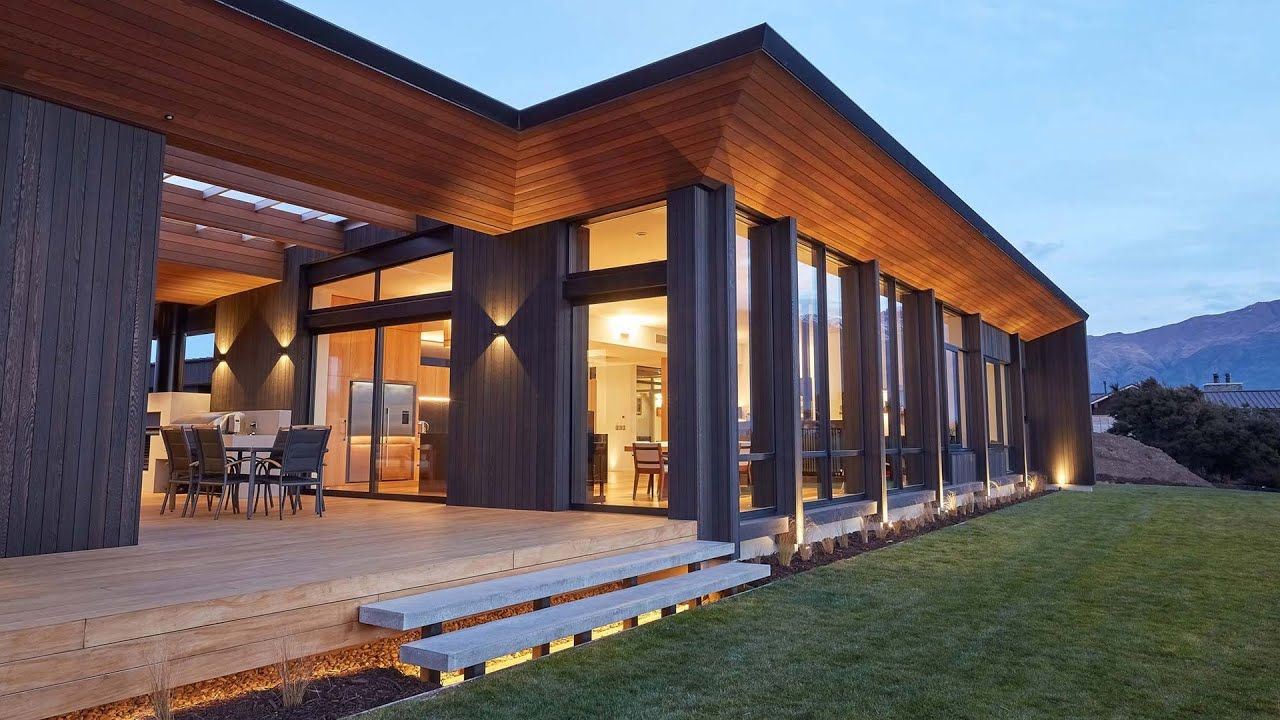 The mountains and lake view over Lake Wanaka is framed by the full height windows on the north facing side of this impressive home. The dark cedar cladding and warmth timber interior creates a warm and inviting home to relax in and take in the views. video