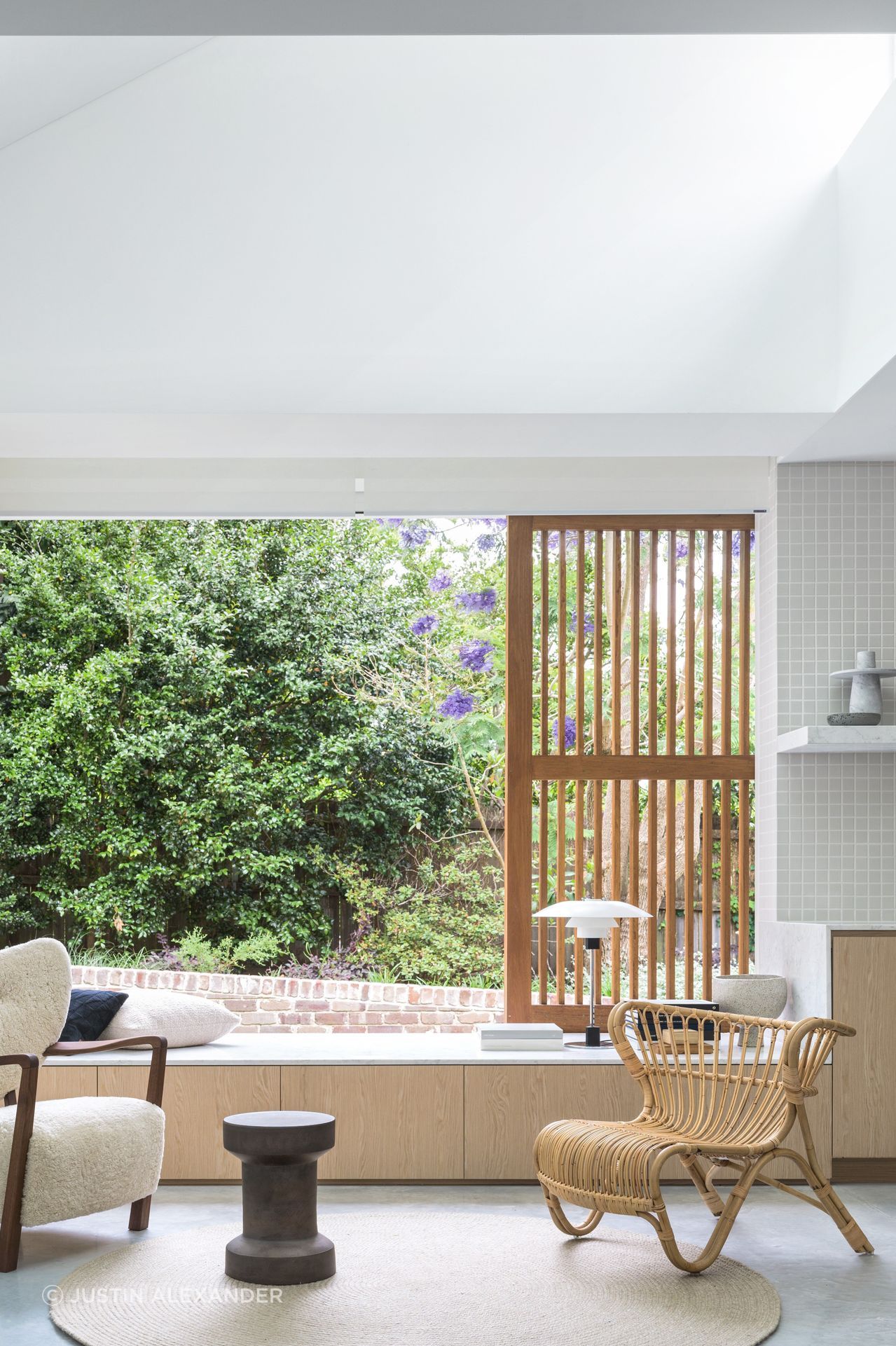 A window seat looks out to the shared garden.