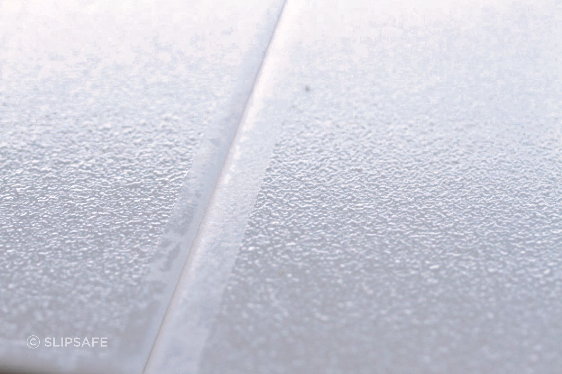 A close-up of Swiss Grip shows its textured surface.