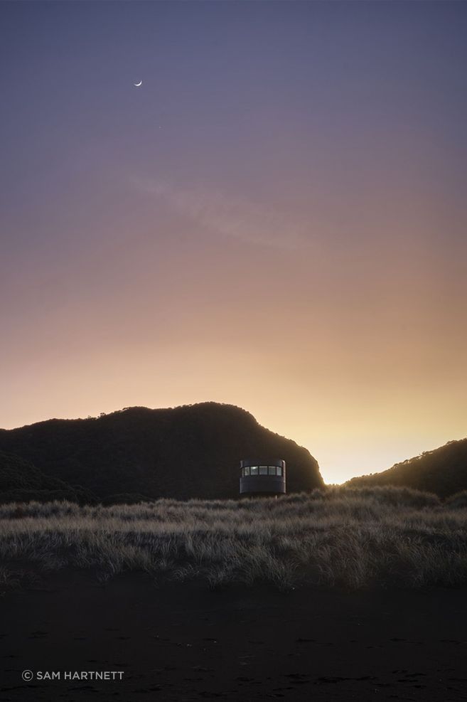 Te Pae at sunrise, peeking gently over the sand dunes.