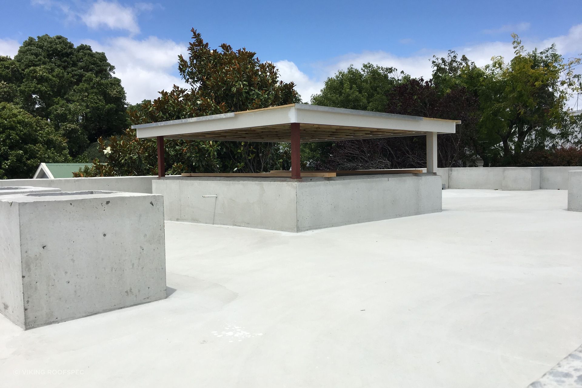 Layers are added meticulously, starting with the waterproofing membrane.