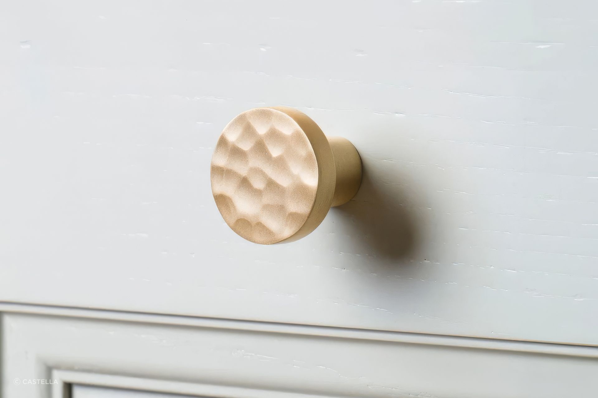 The Tarn Knob in Satin Brass Finish, Featuring a Hammered-detail Face