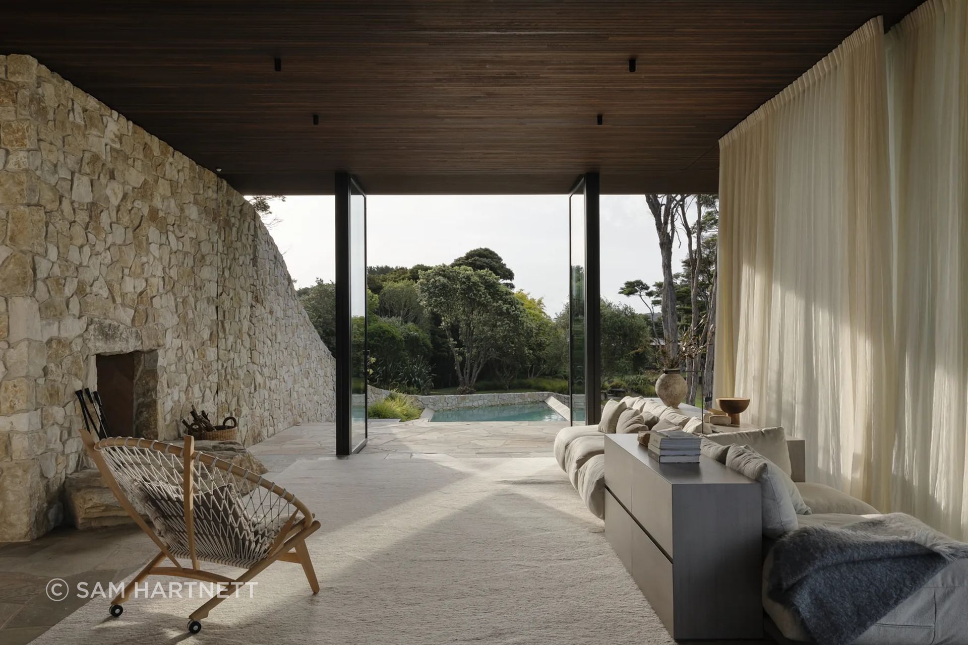 Inside Waiheke House, the limestone brings texture, weight and permanence to a quiet living space, translating a natural material into a refined architectural moment.