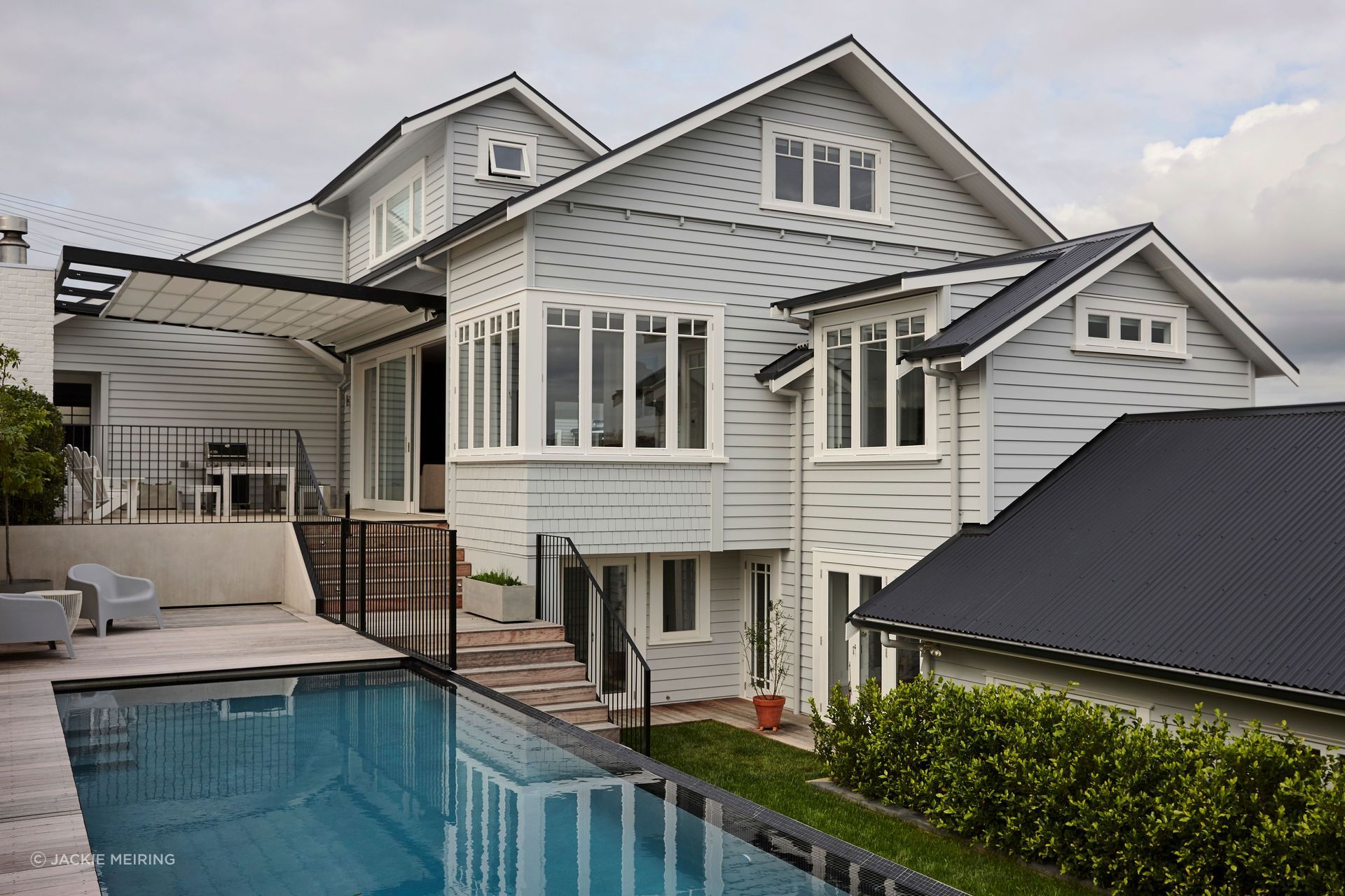 This bungalow renovation and extension in Northcote Point included a new top floor, extension and rebuild to existing addition of a garage, new outdoor living area and pool.