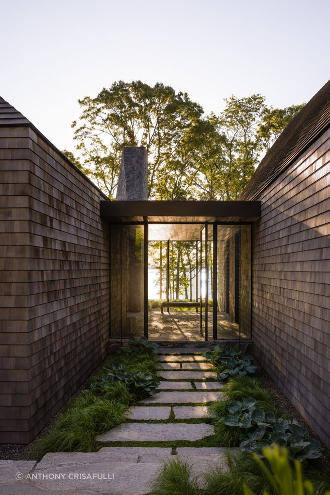 In a LaGuardia Design Group project in New York, the buildings, walkways, terraces, and pool were all planned to fit into the existing topography, preserving the surrounding Oak and Cedar Forest.