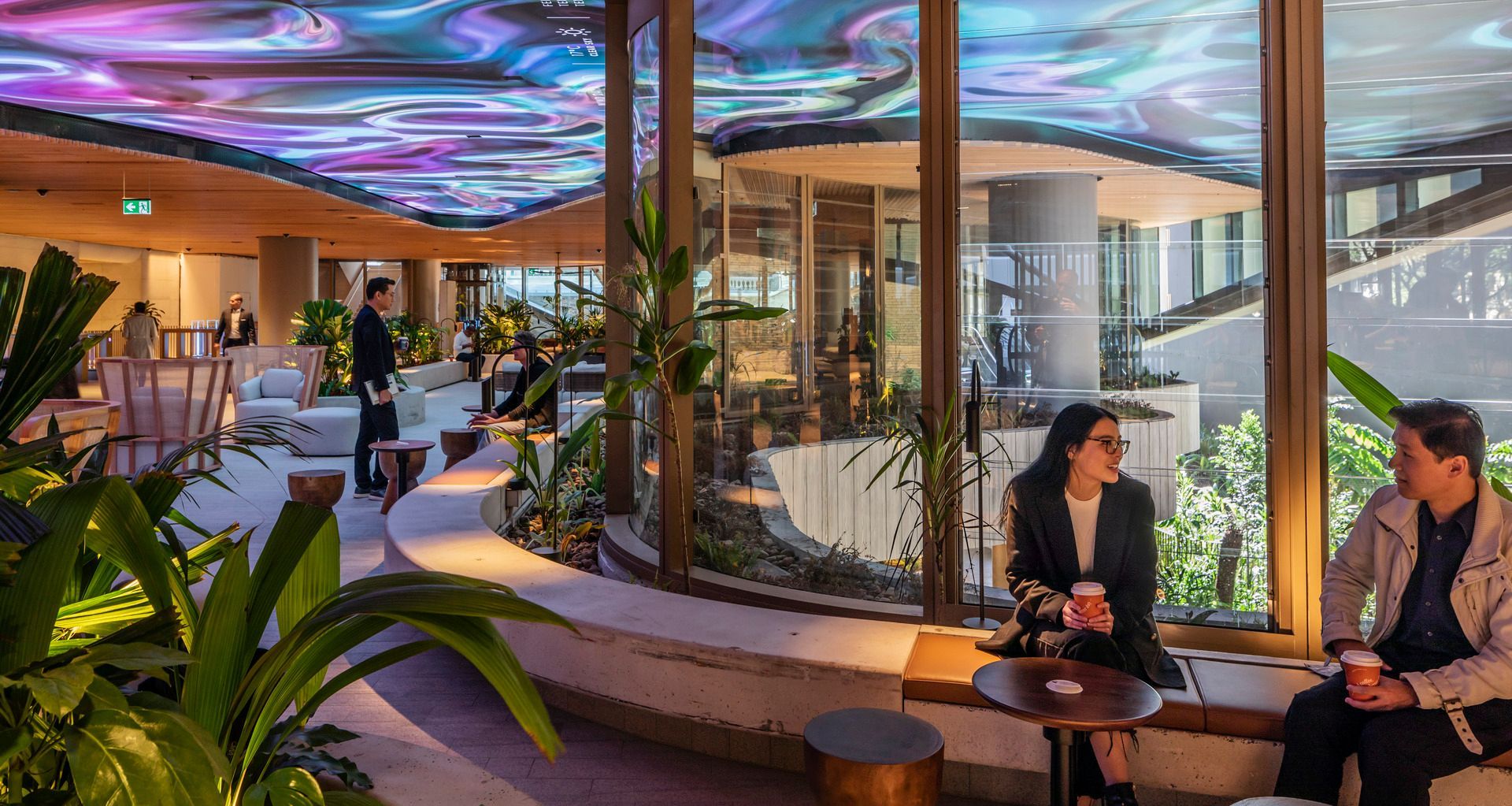 A changing digital artwork on the ceiling of at 80 Ann Street by Woods Bagot ensures the space is dynamic and ever-changing. Image credit: Trevor Mein