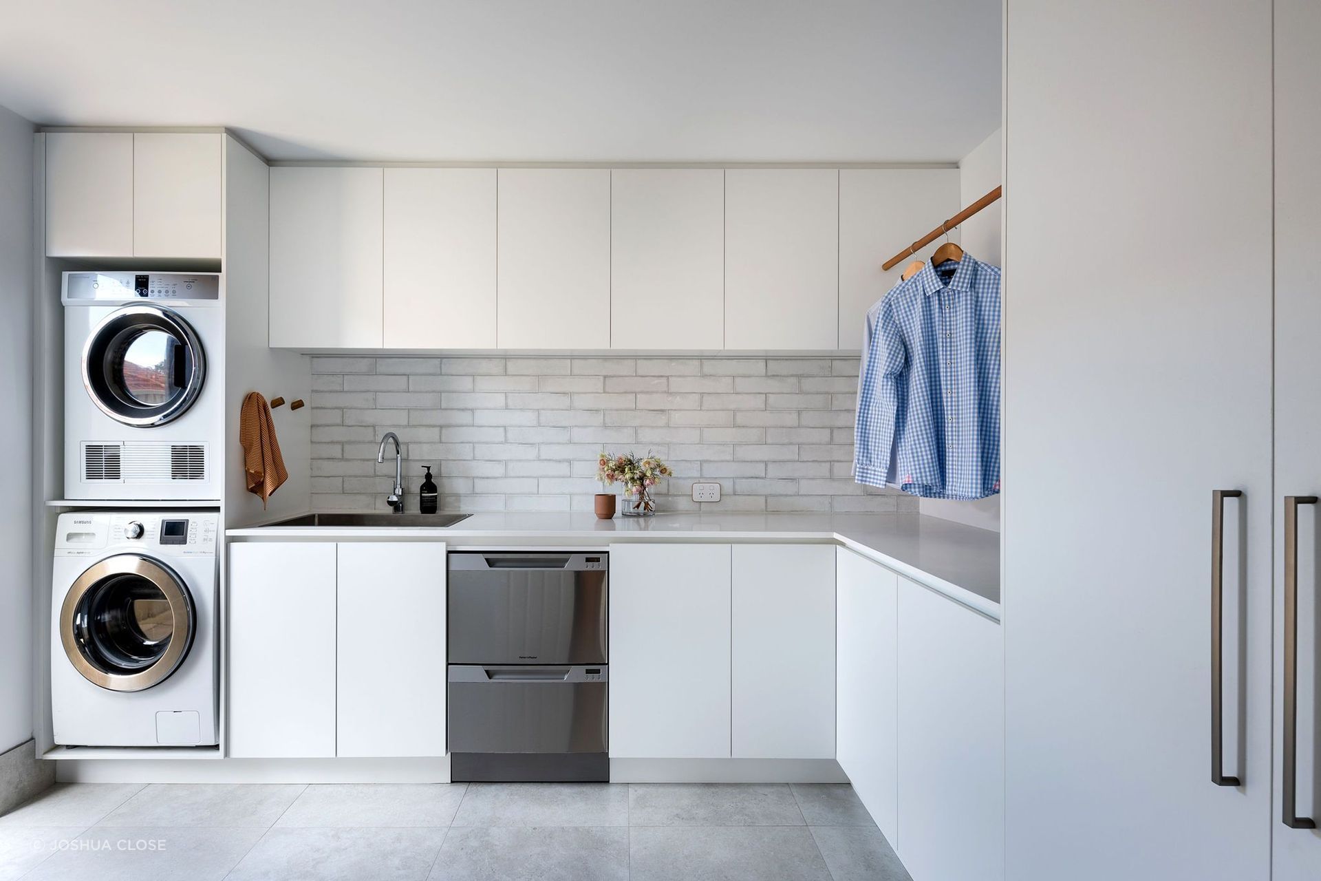 Front loaders are both water and energy efficient making them a popular choice for the family home, as seen in this stylish space by Adela Design. | Photography: Joshua Close