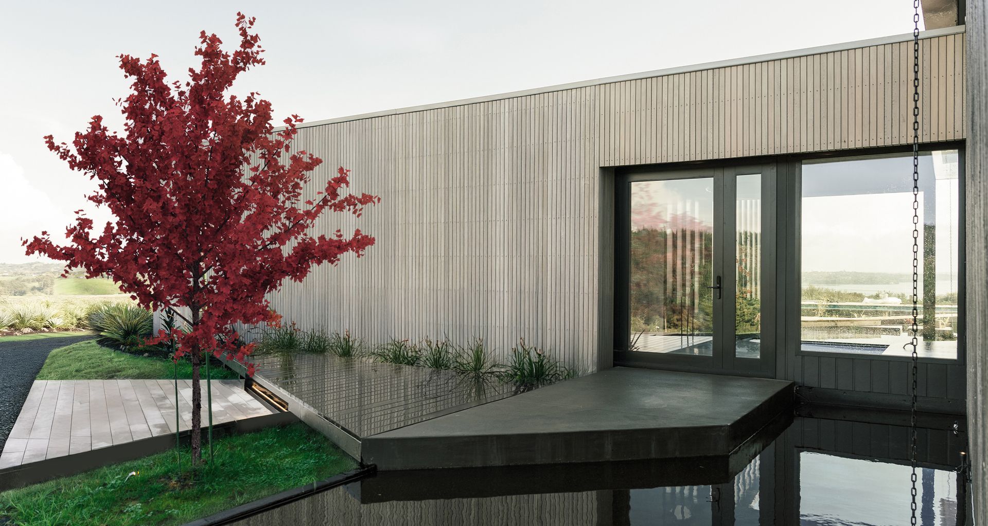 Azeem House is conceived around the layered rhythms of multi-generational living, balancing shared spaces, private retreat and moments of quiet ceremony within a coastal setting.

Architecture: Construkt Architects
Photography: Calvin Hui