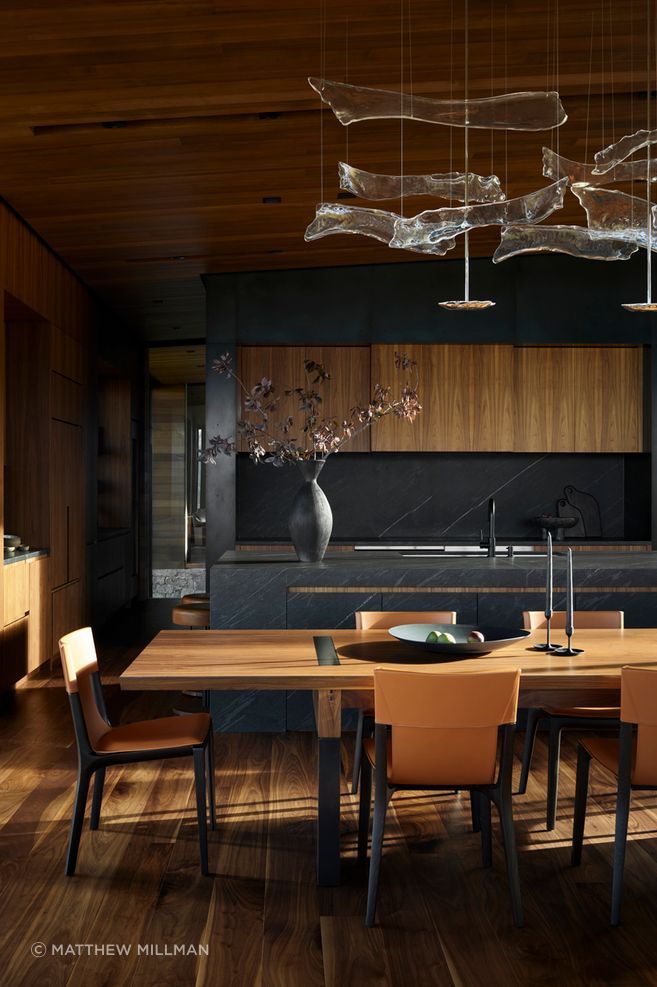 Walnut, stone and dark metal surfaces create a warm but highly resolved interior palette, showing how material specification can bring depth, permanence and craft to everyday spaces.

Architecture: CLB Architects