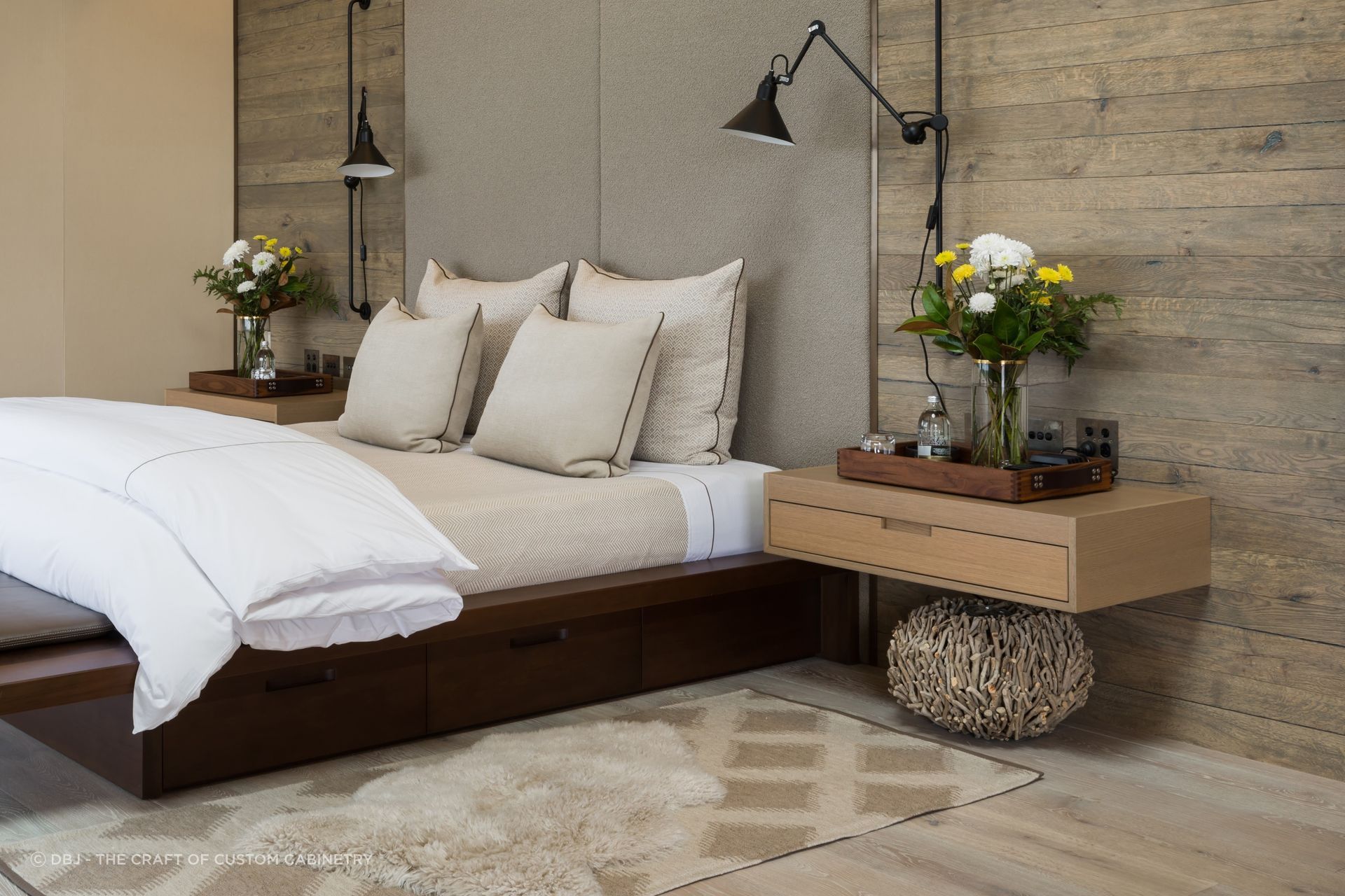 Wall mounted bedside tables, like these custom made bedside tables by DBJ, free up floor space for other items of decor.