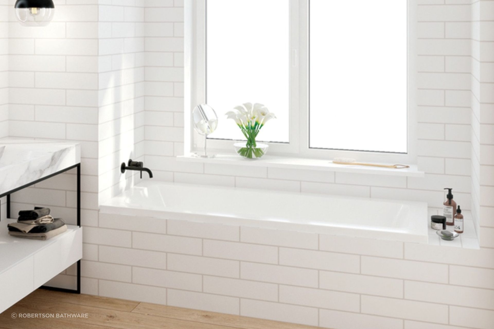 A sleek example of a drop in bath from the Elementi Collection by Robertson Bathware.