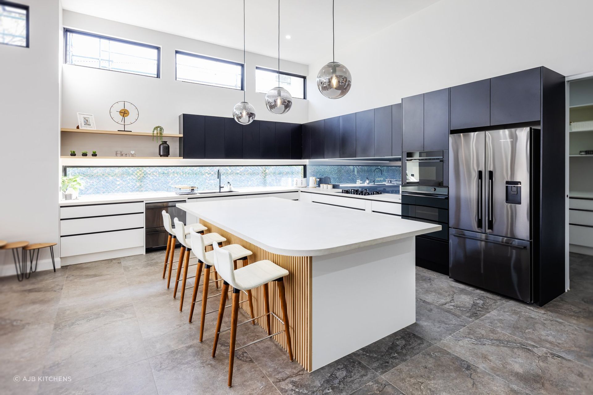 Globe pendant lights, while looking a little retro, still work in modern kitchens.