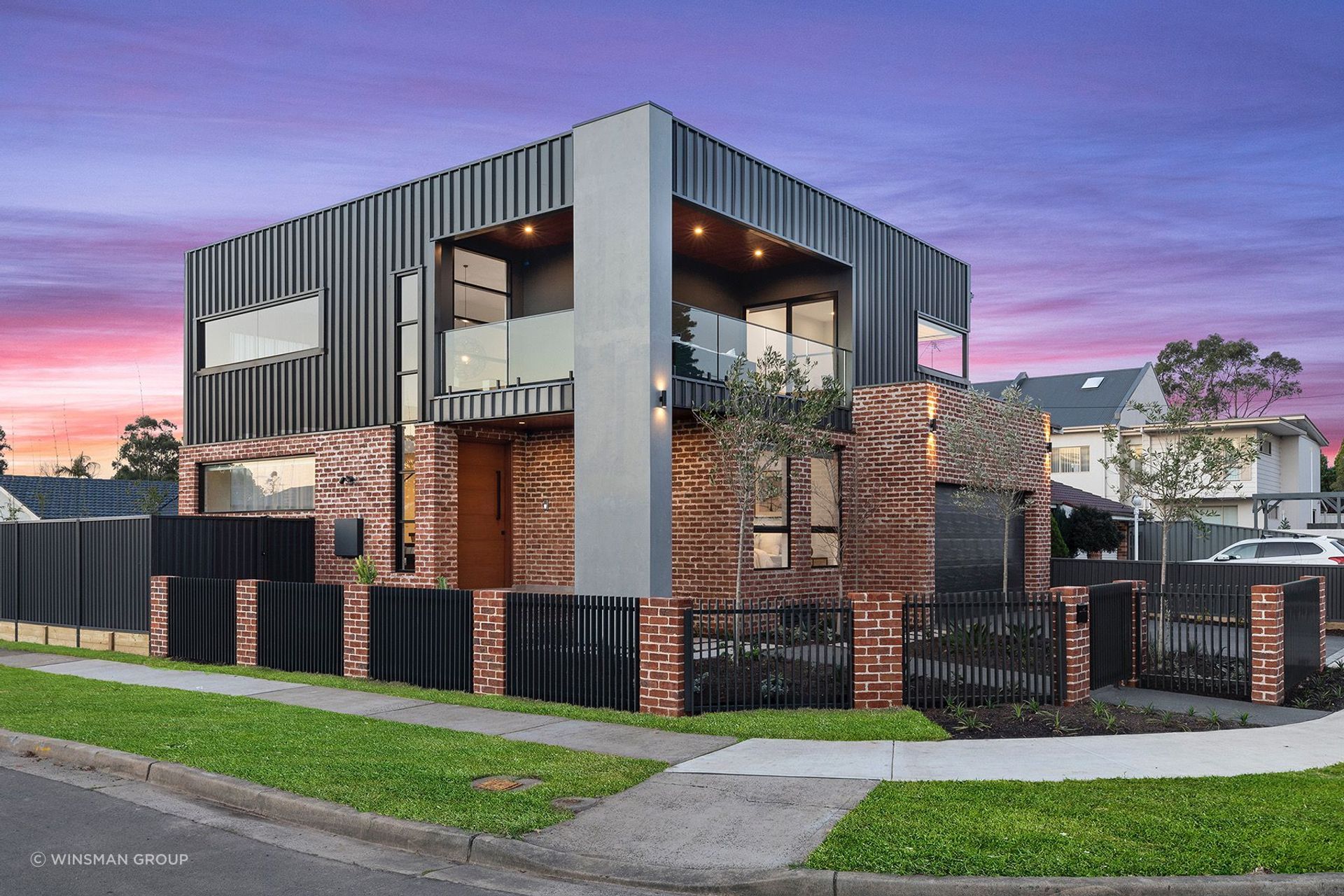  The contrast between the rustic brick, concrete forms and sharp-lined cladding is striking. Featured project: Sammut.