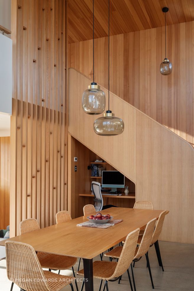 The staircase and mezzanine floor create several spaces under one roof