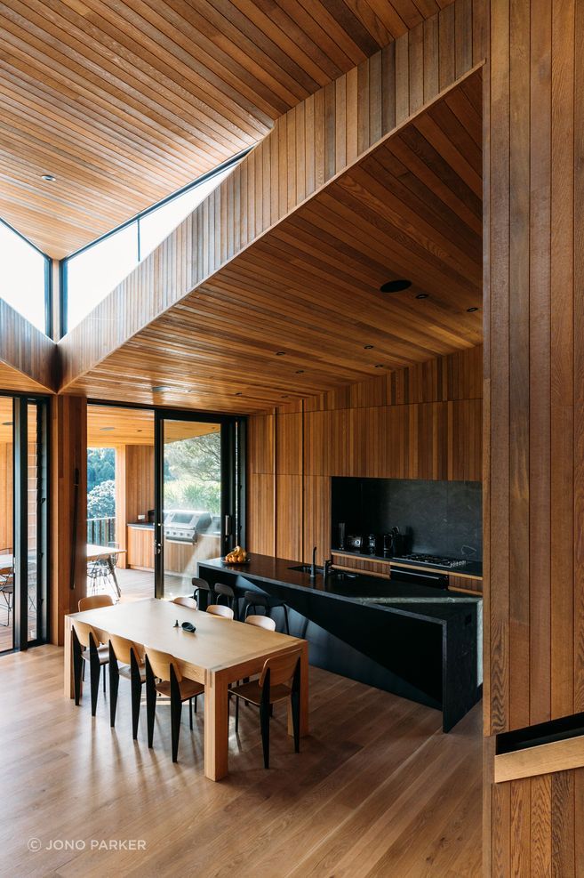 Timber-lined ceilings and walls bring warmth and continuity to the interior of Sandy Bay House, where careful planning and a double-height volume allow a compact coastal home to feel open, generous and deeply connected to its setting.

Architecture: Stevens Lawson Architects