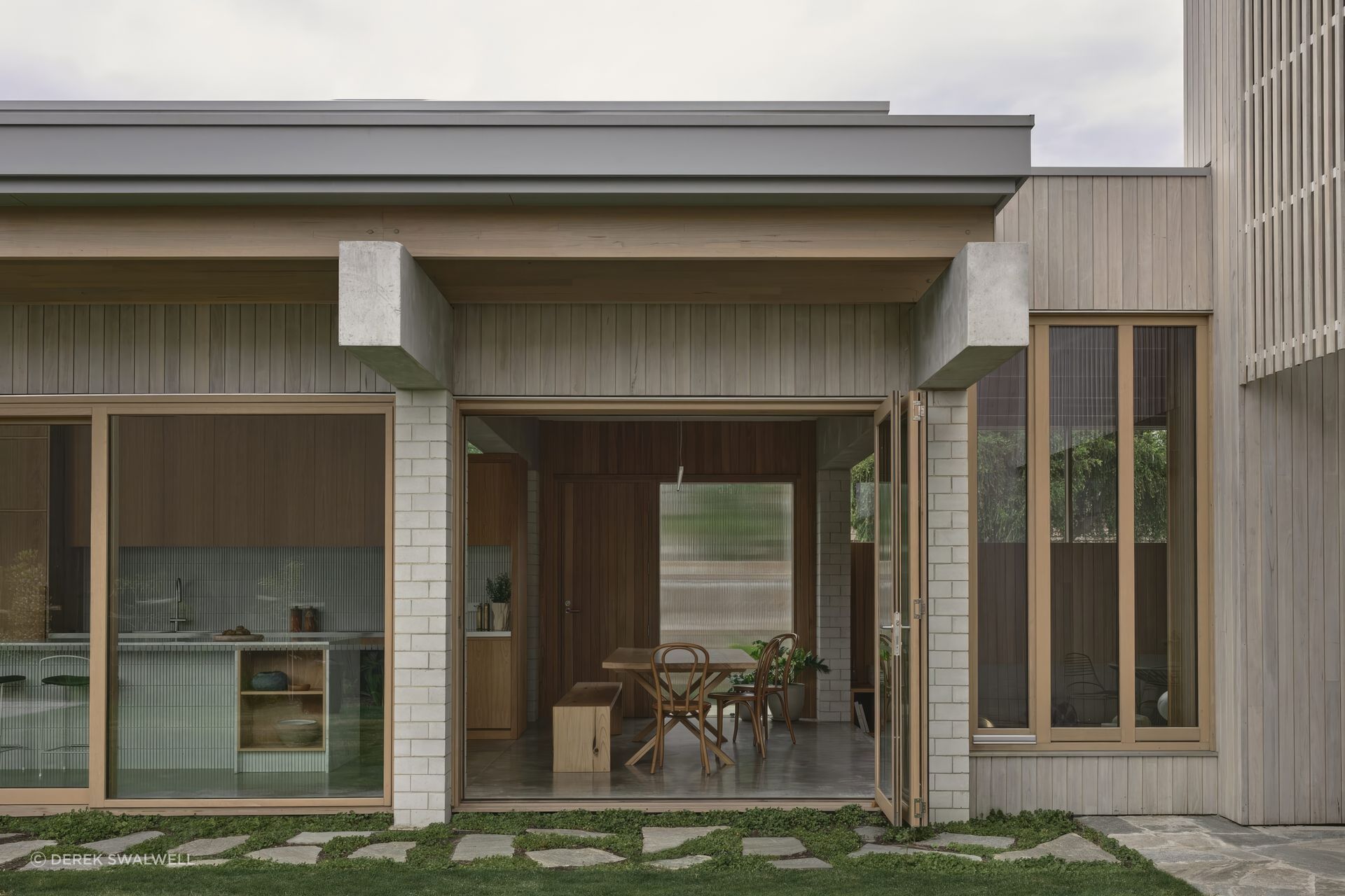 Home Pavilion brings the kitchen, dining and living spaces into a clear social centre, creating a home that can hold the everyday rhythms of family life as easily as larger moments of gathering.

Architecture: MRTN Architects
