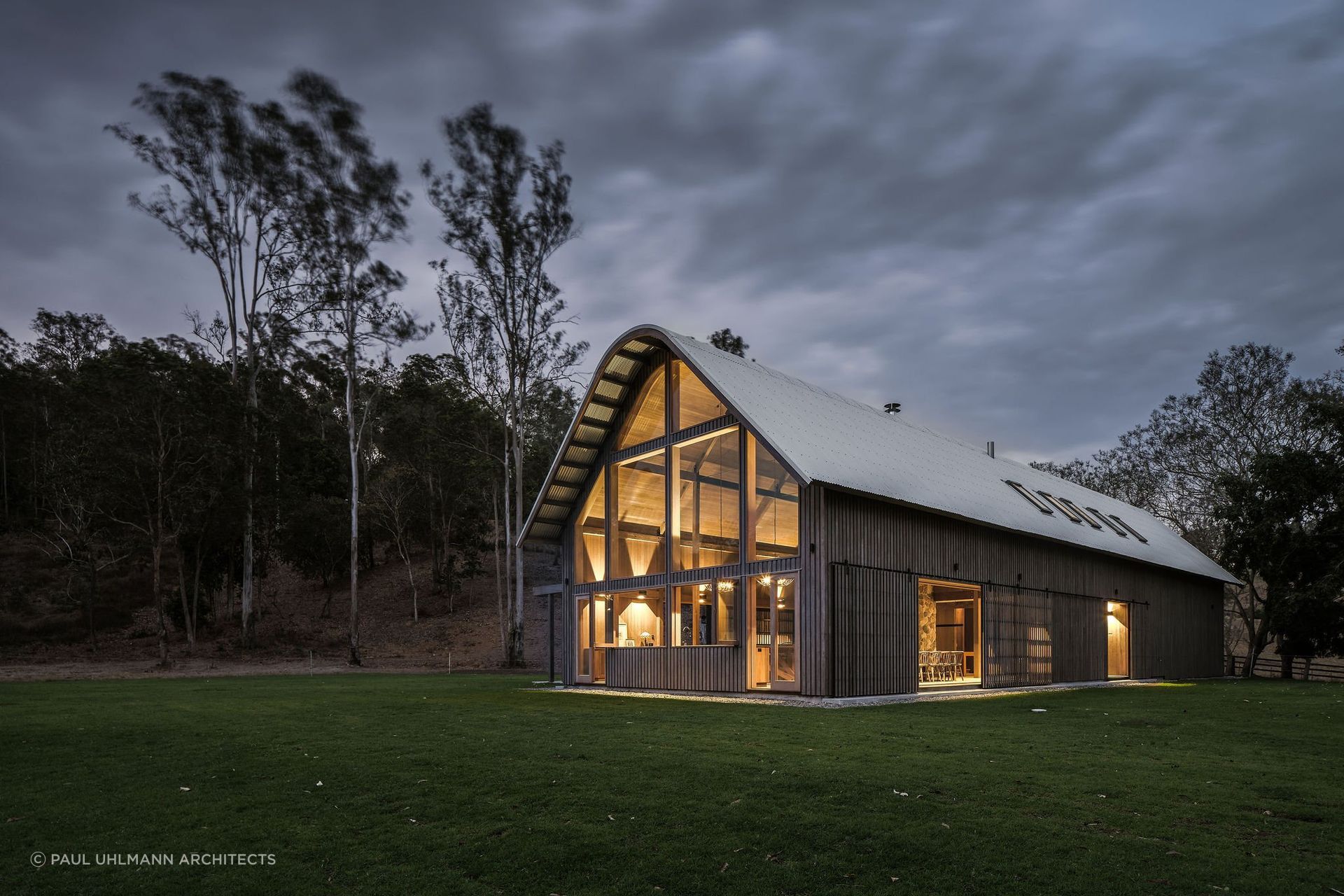 A gambrel roof, characterised by its two-sided, dual-slope design, maximises space and adds a touch of vintage charm, reminiscent of classic barns or farmhouses. Featured project: The Barn