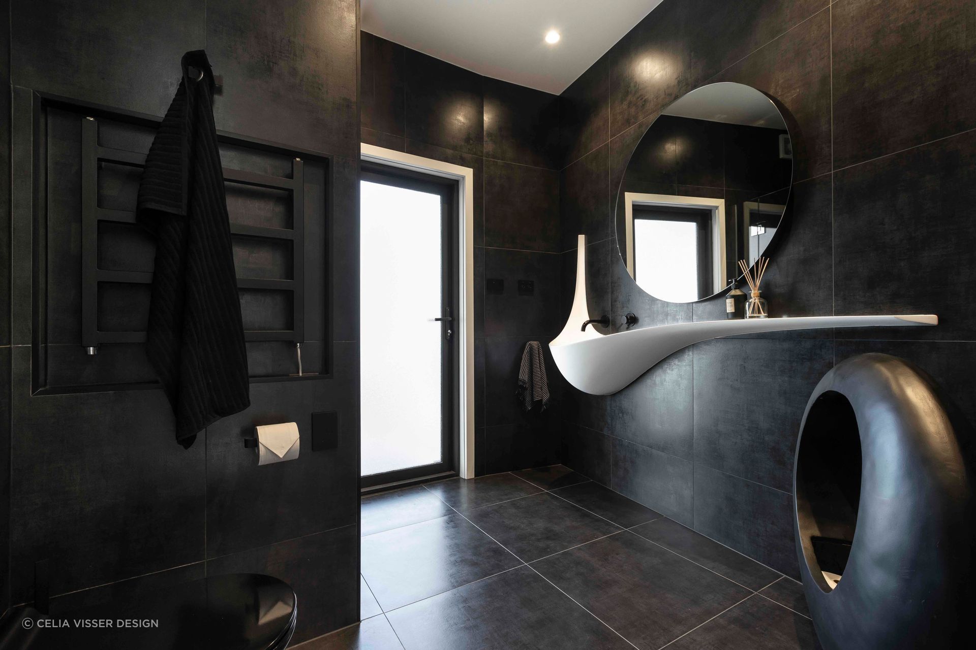 Black, bold and brilliant — the Wiri bathroom.