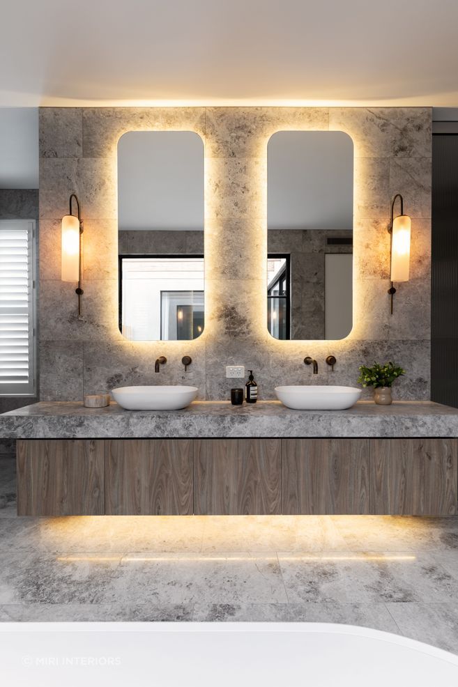 Stylish bathroom lights can help other key features stand out. Featured Project: Brighton Suite by Miri Interiors