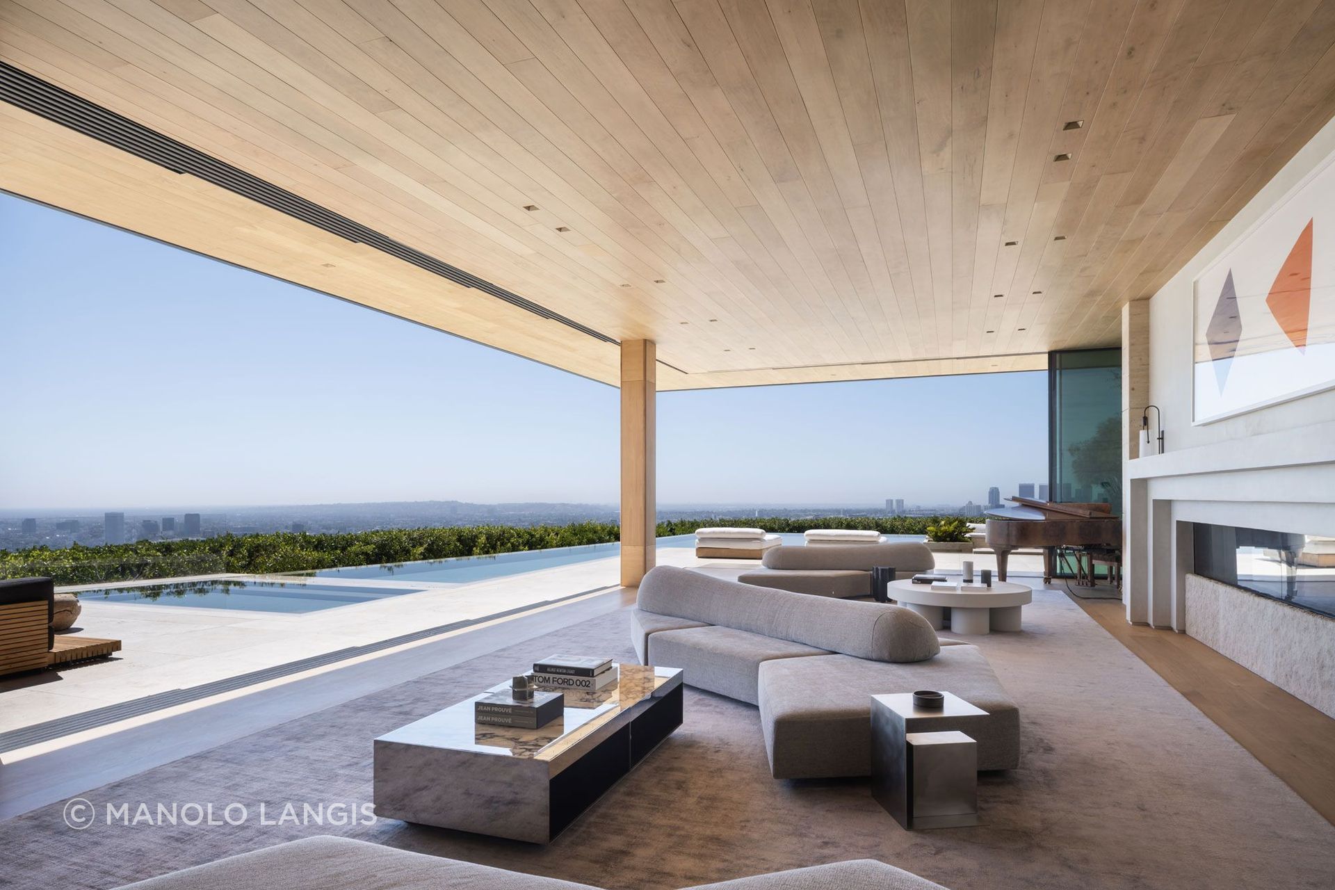Aria brings water, warm materiality and generous thresholds together in a family home designed around gathering and view.