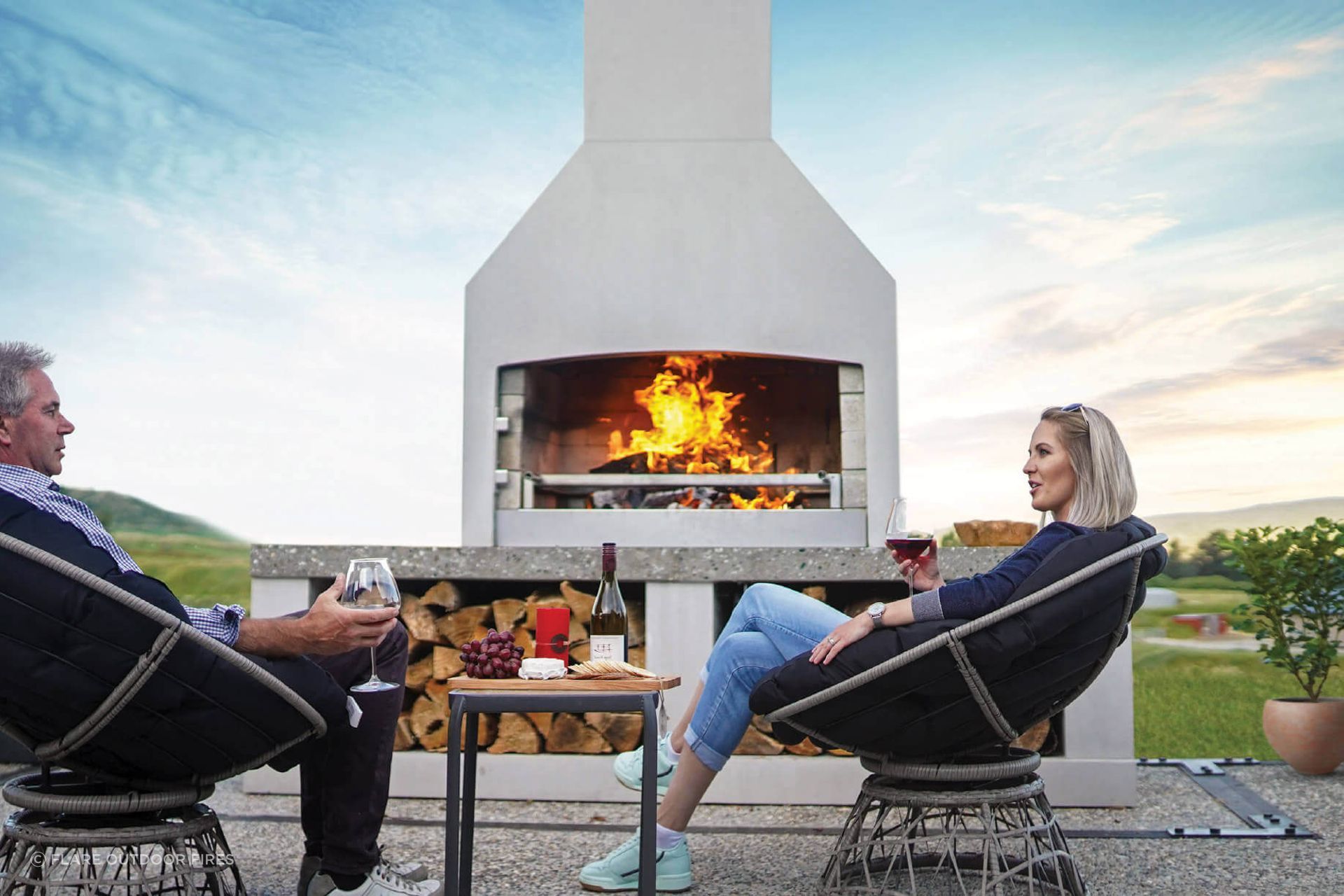 A stylish outdoor fireplace can transform a patio or outdoor dining area. Featured product: Premier Fireplace.