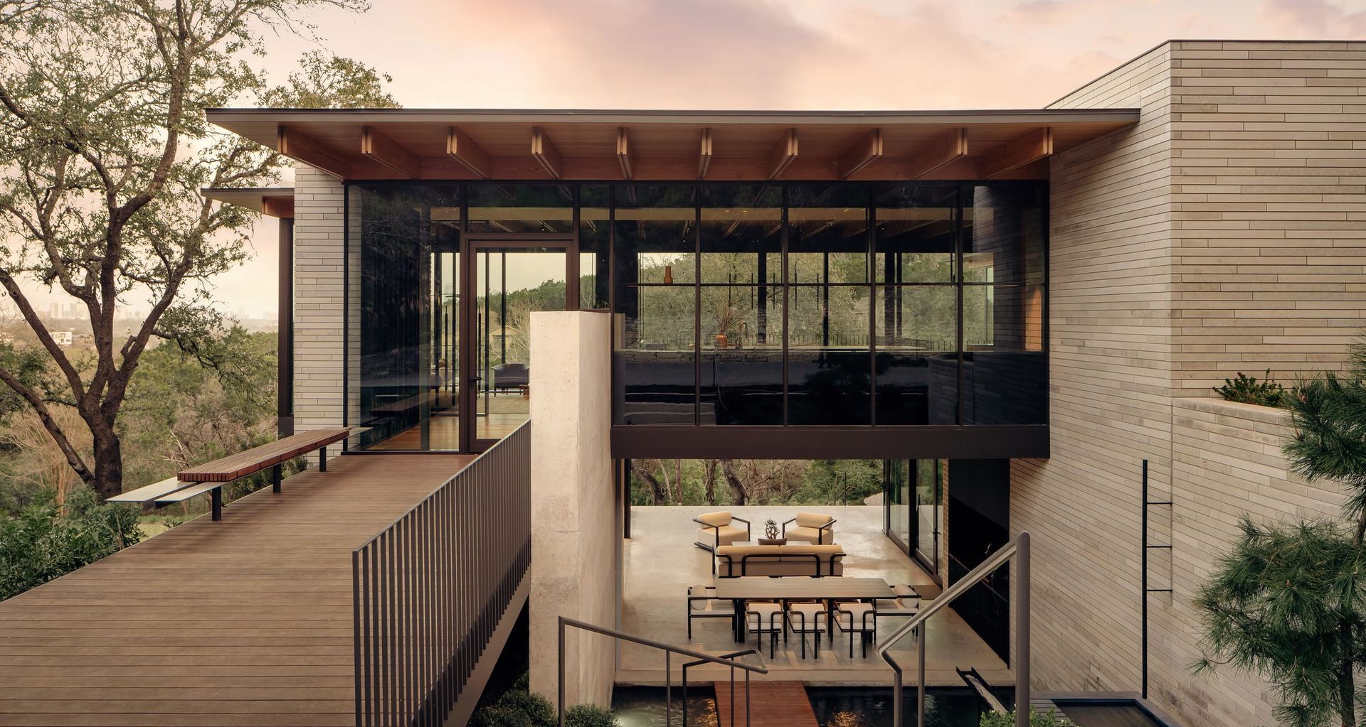 Set on a limestone bluff above Austin, Terrace Mountain Residence frames daily life through light, material and landscape, using interlocking stone, glass and timber volumes to create a home that feels both grounded and open to the horizon.

Architecture: A Parallel Architecture
Photography: Joe Fletcher