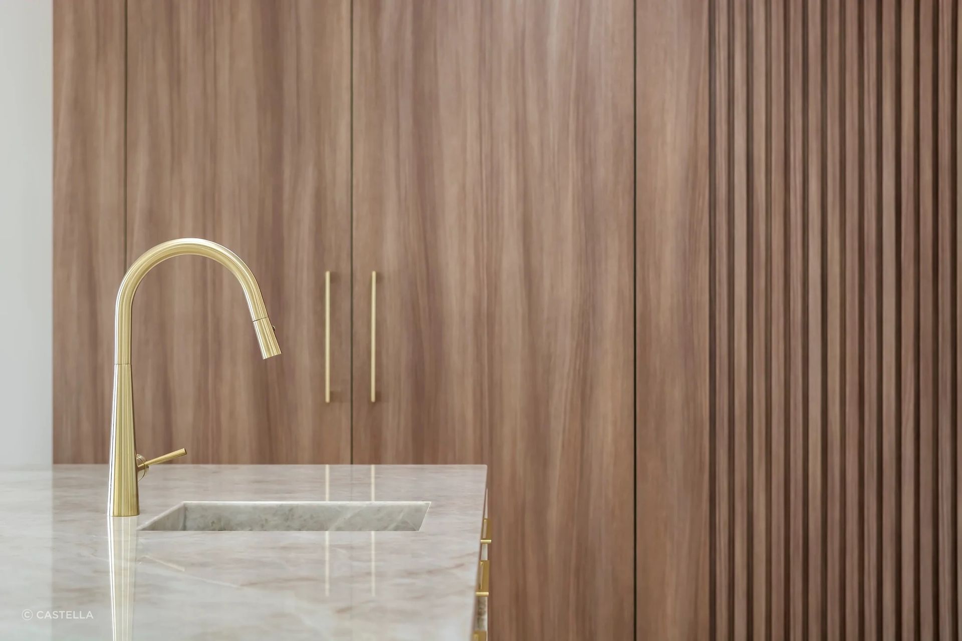Kitchen Project Featuring Castella Cove Cabinet Handle in Brushed Brass Finish