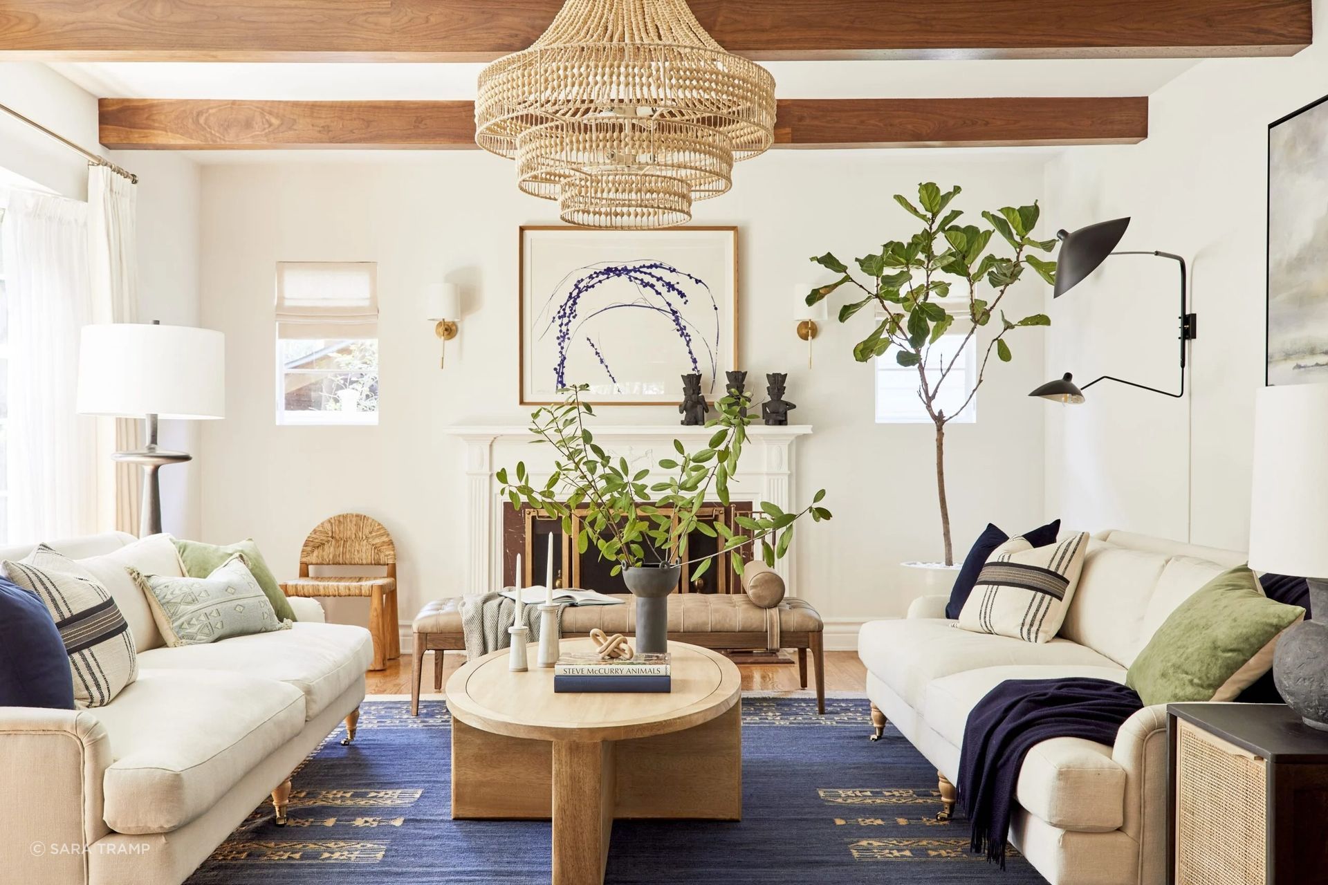 Drawing on a mix of influences and styles, Bobby Berk turned this 1950s traditional into an eclectic and comfortable home for clients. An earthy color palette of blues, greens, and lighter tones accentuates the classic architecture, while pattern and natural textures connect to one of the client’s childhood growing up in India.