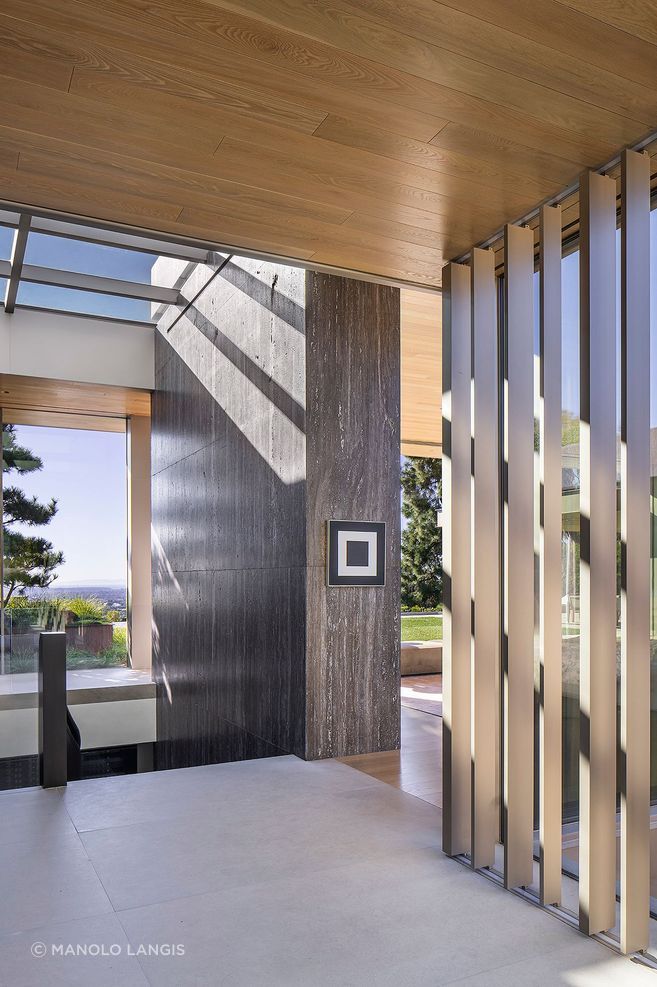 Skylights and trellises become part of McClean Design’s light strategy, bringing daylight deeper into the home and creating patterned shadows that move with the sun.