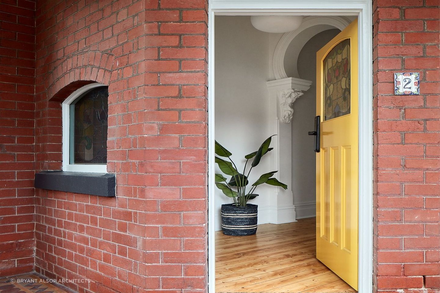 A yellow front door gives a home a bright, welcoming feeling. Featured project: Pine by Bryan Alsop Architects