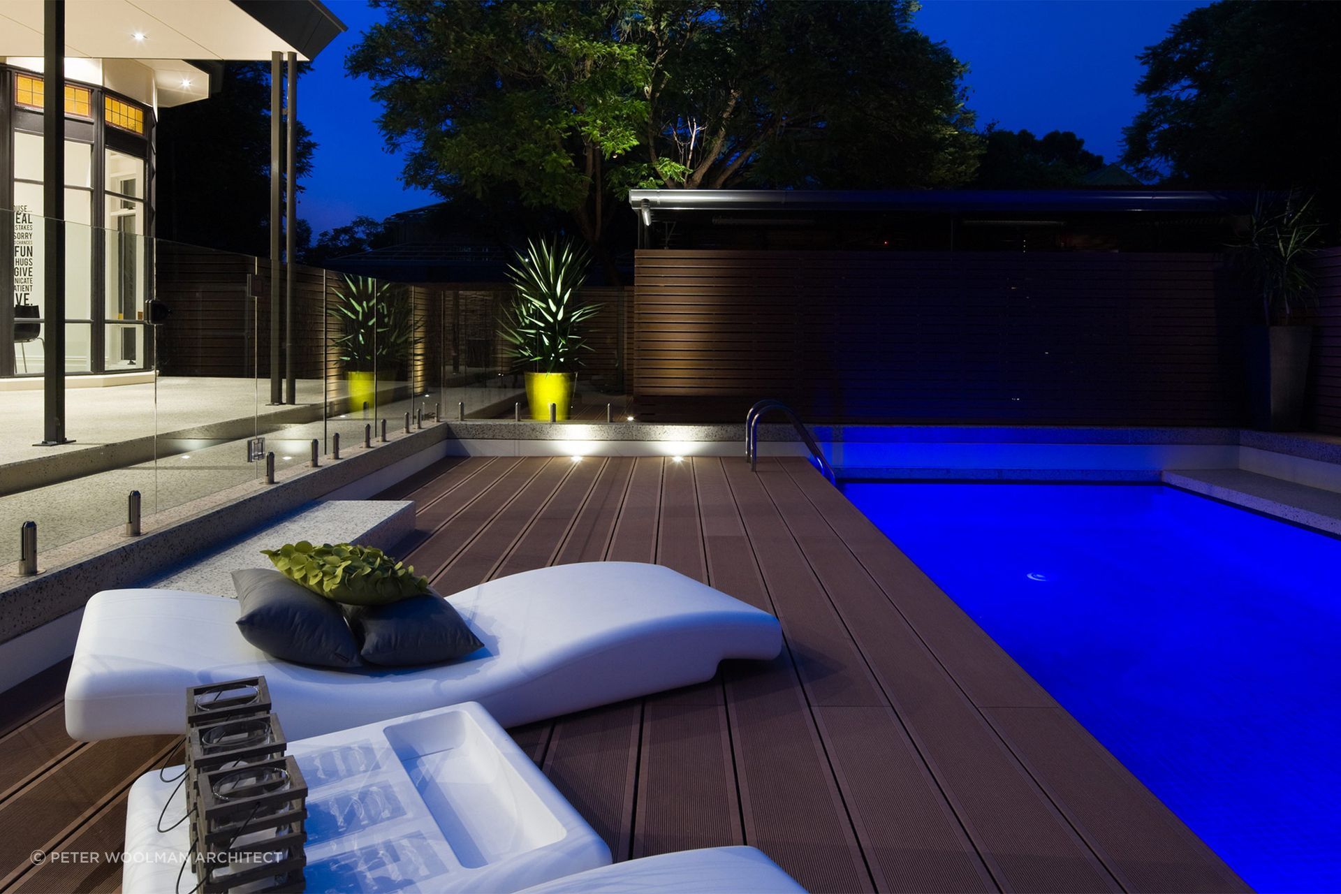Soft outdoor loungers help create a functional outdoor space. Featured project: The Pool Deck Unley - Peter Woolman Architect