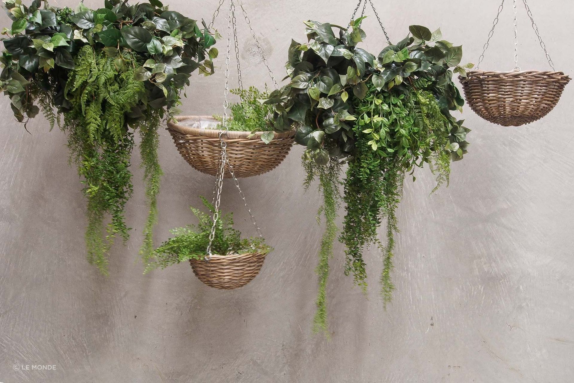 Hanging baskets are a pretty, biophilic addition to a home office. Pictured are rattan baskets by Le Monde.