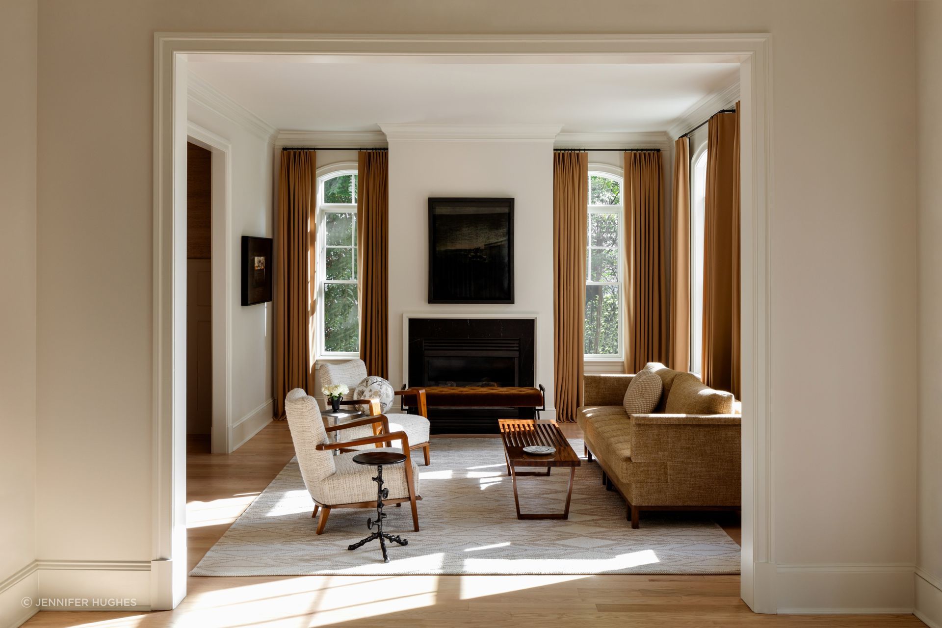 A gracious center hall linking front to rear defines this semi-traditional home. While the relationship of rooms were laid out sensibly, the interior spaces lacked connection, scale, spatial clarity, and a consistent design language.