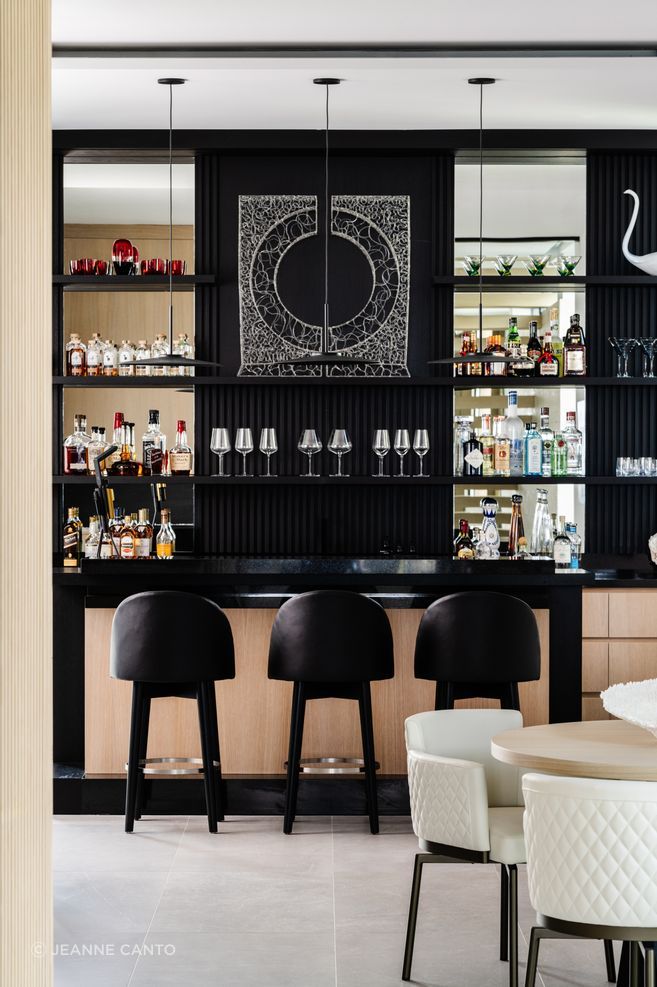 Sun, sand, and sky served as the basis for North Ocean's interiors. The first floor is grounded by darker tones and earthier materials such as Florida Keystone and dark textured stucco that embody
shadow and dune.