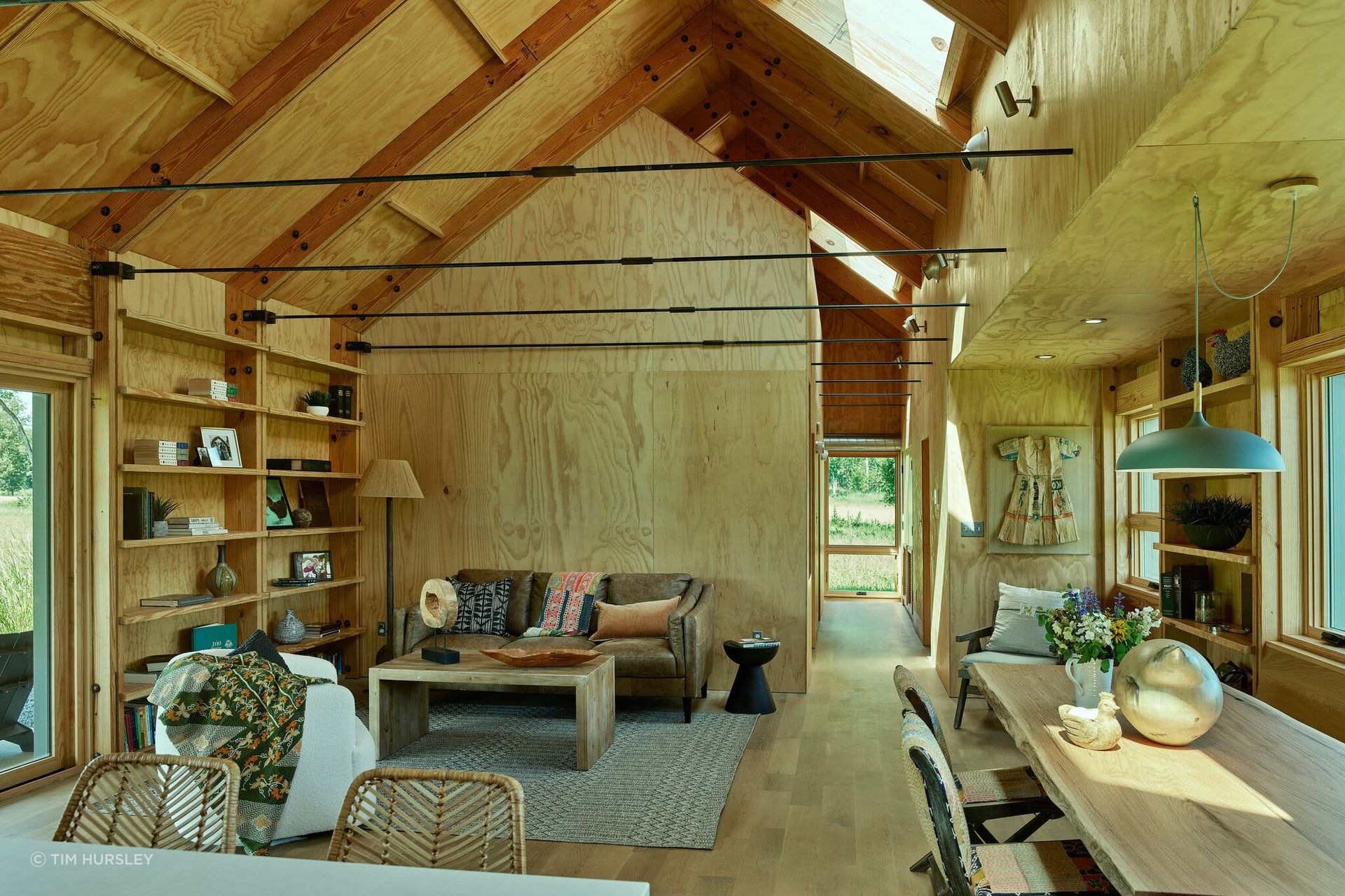 Inside, the Southern yellow pine framing and sheathing is left exposed.