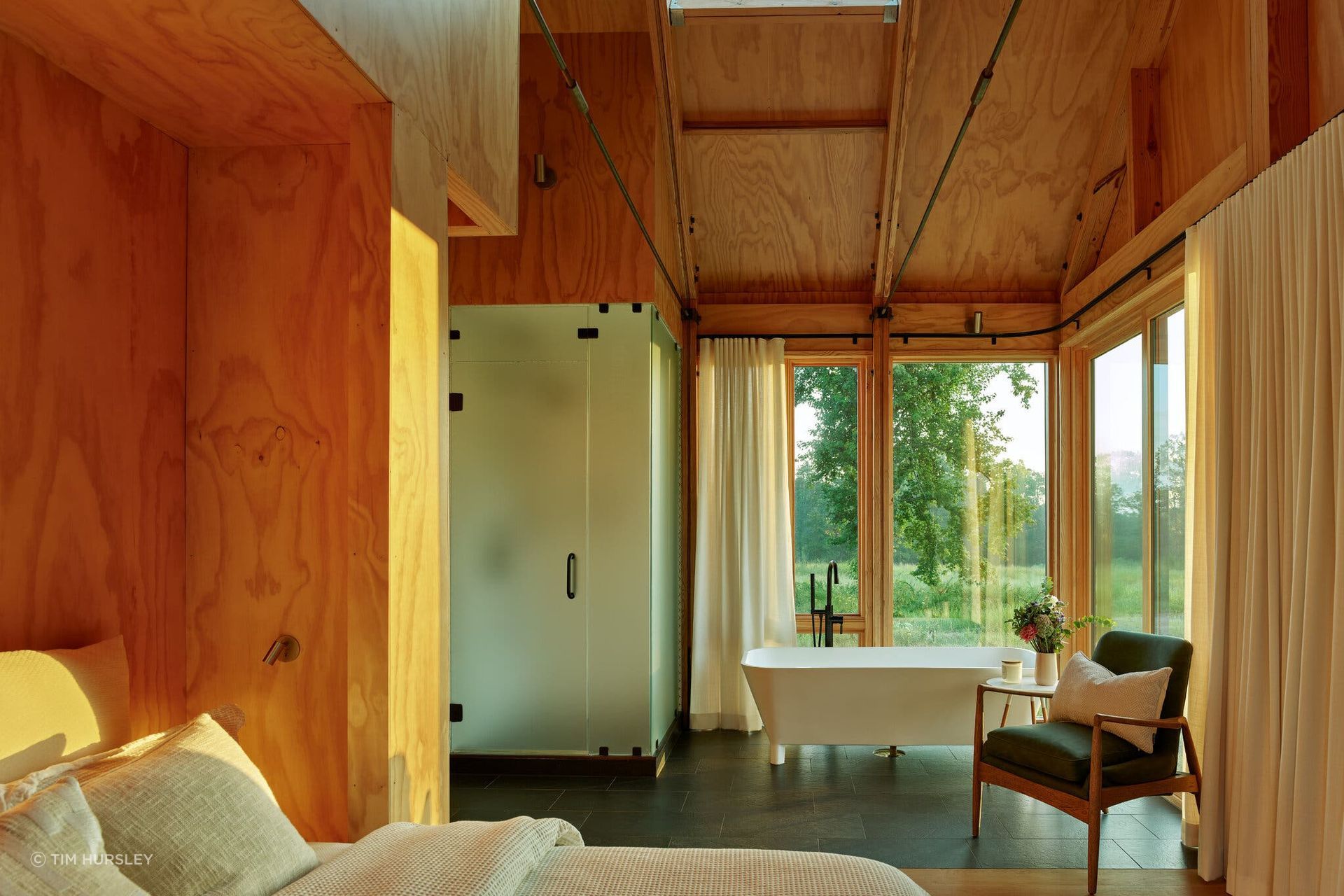 The primary suite has a soaking tub positioned to take in the views.