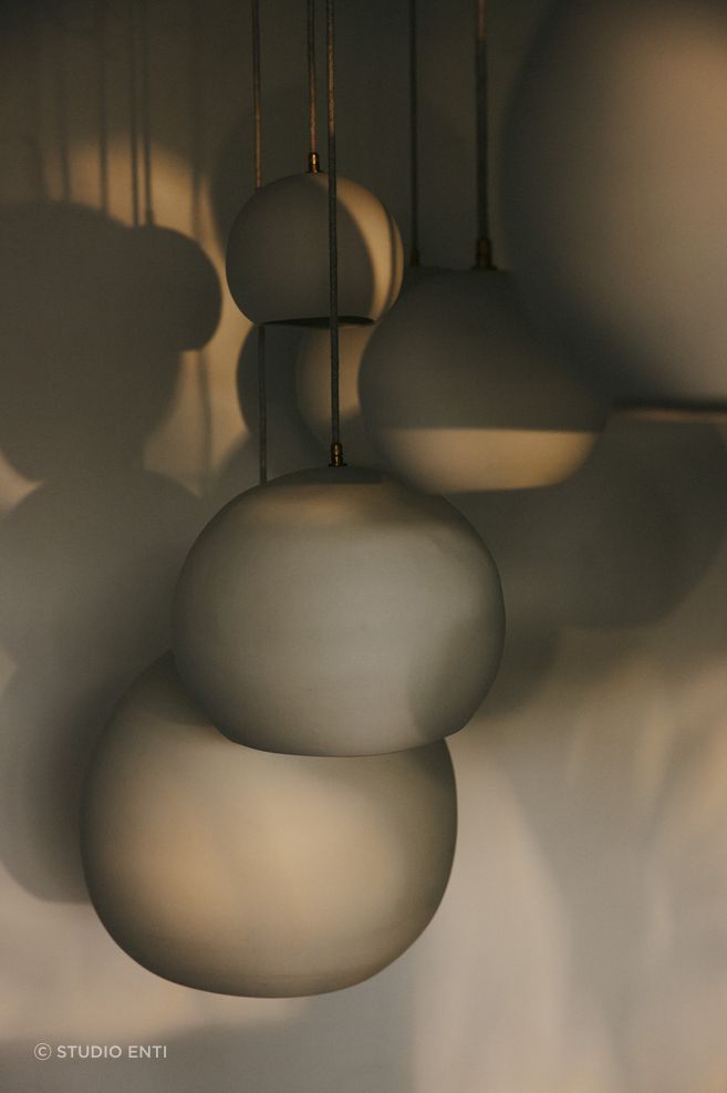 Hand-carved, the pendants are made from Australian porcelain.