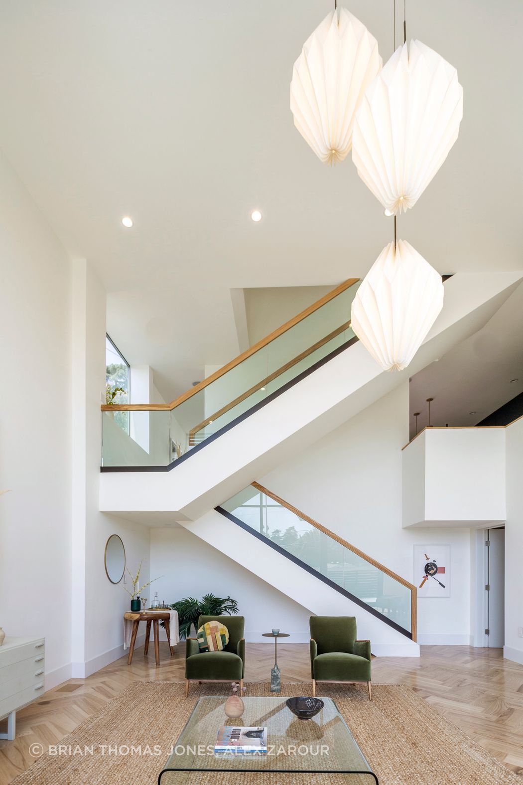 Organized as a staggered sectional volume distributing program over three levels, Echo House is situated over the utilitarian spaces located at street level. Living spaces occupy the multi-level second floor with direct access to the outdoors via the front deck and the rear terrace, physically expanding the interior. The third floor, accessed by the expressed scissor stair, consists of the bedrooms and bathrooms.