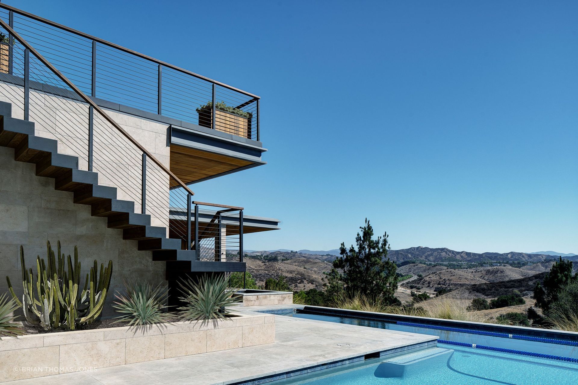 Much of the initial site orientation traced back to the husband, Dave, whose fascination with the distant views, and a few specific vistas he wanted locked into the design, set the rotation of the house early on.