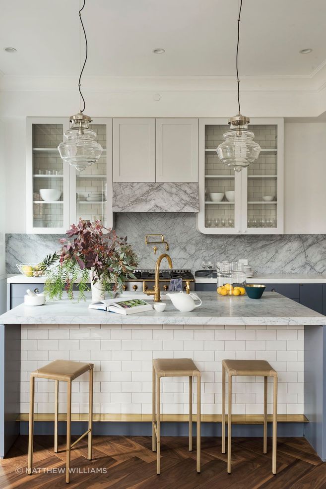 "We introduced details we had originally conceived for client projects but never used, such as kitchen cabinets with gently curved corners and marble flooring with circular brass inlays," says the Zuninos of their Brooklyn townhome project.