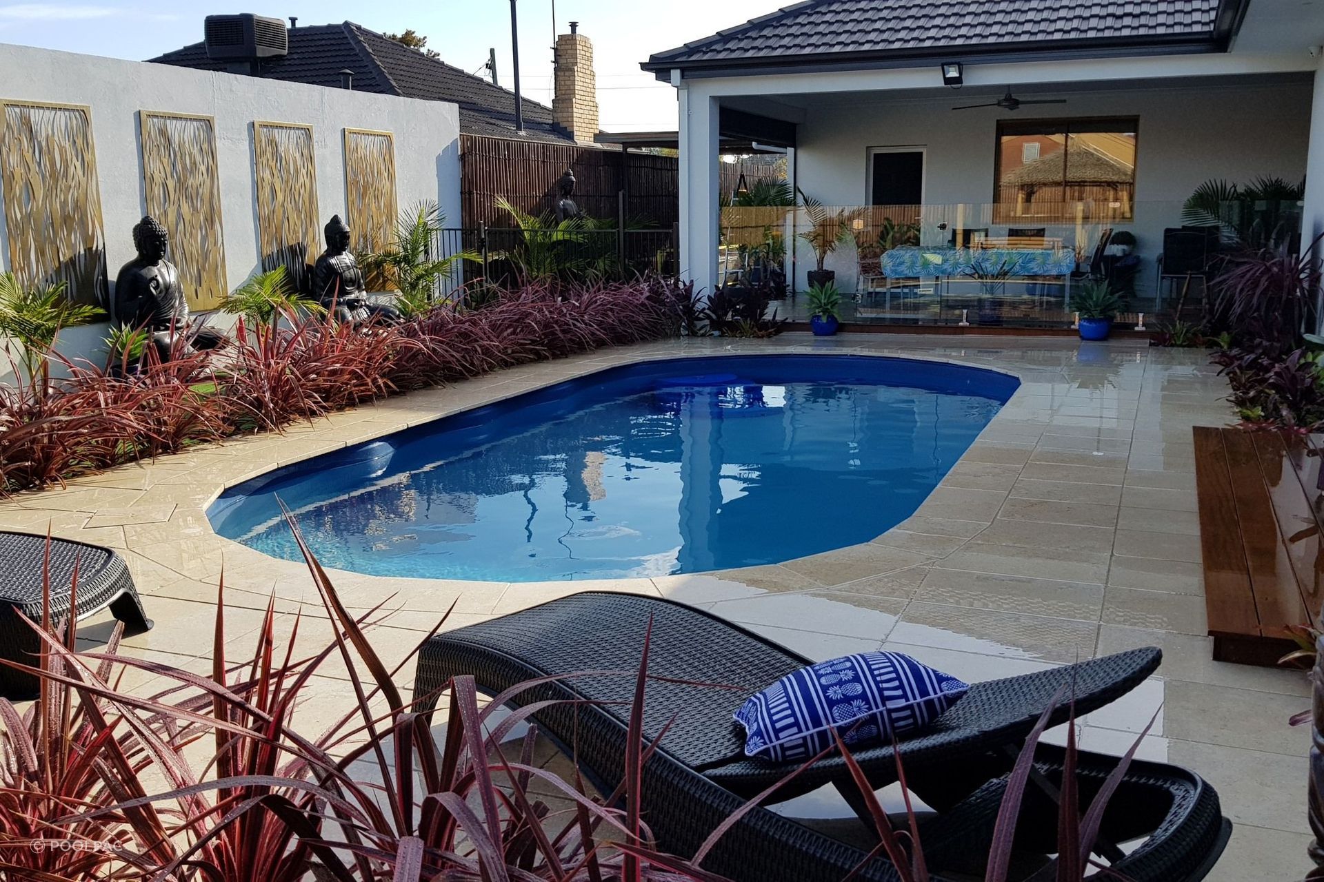 Oval pools, like the Classic Majestic Swimming Pool by Poolpac, enhance the natural feel of an outdoor living space.
