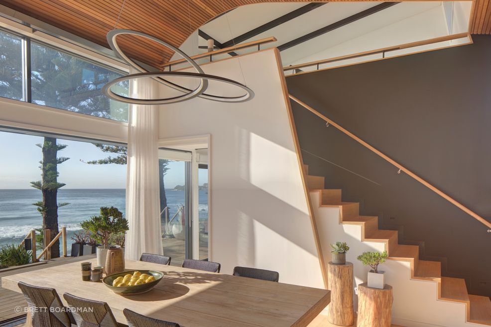 The sculptural pendant gives a nod to the curvacious form of the ceiling.