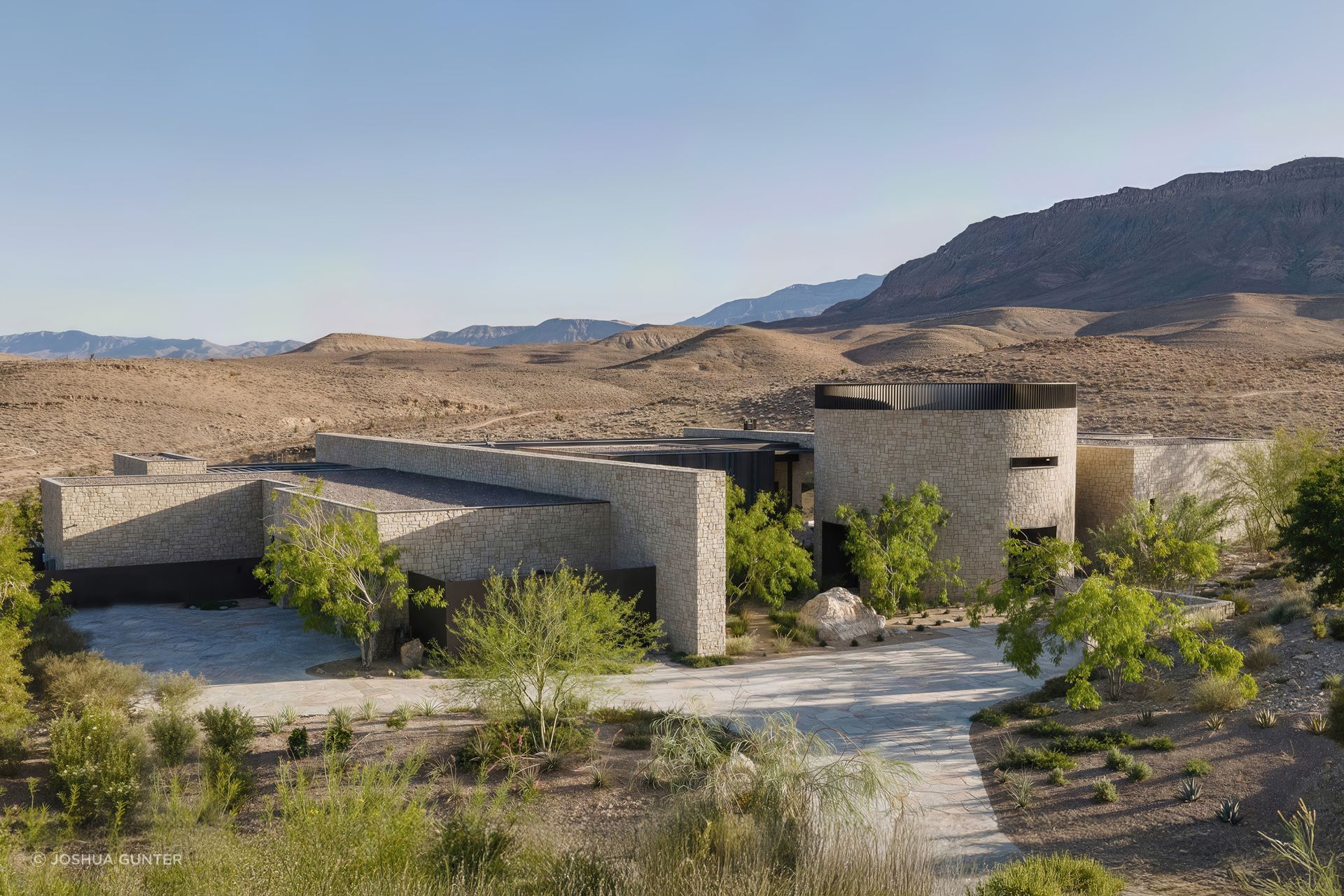 Fort 137 emerges from the desert as a series of interconnected stone volumes, rooted in the landscape and shaped by climate, topography, and place.