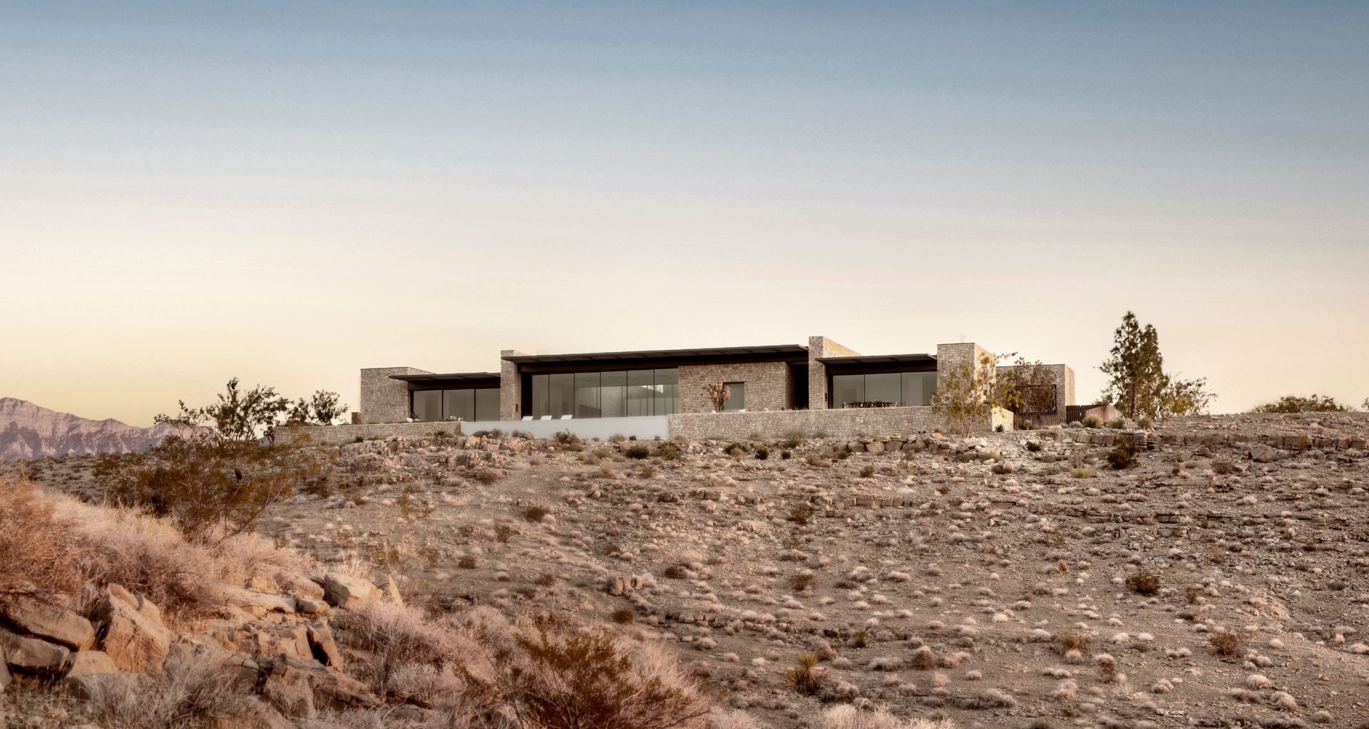 Set along the western edge of the Las Vegas Valley, Fort 137 appears to rise from the desert itself, a contemporary interpretation of a Southwestern stronghold shaped by earth, light, and time. Photo by Stetson Ybarra