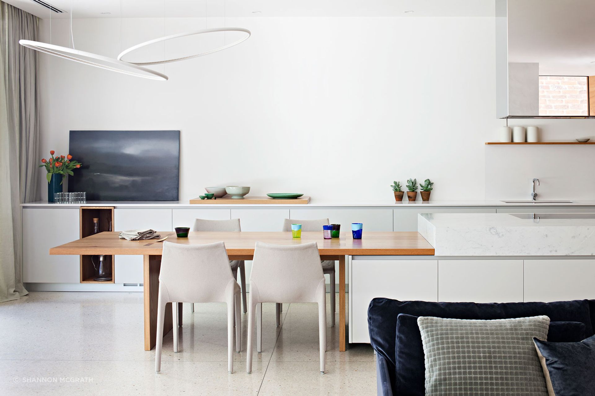 Clever storage and layout makes the kitchen at Victoria Gardens elegant and adaptable.