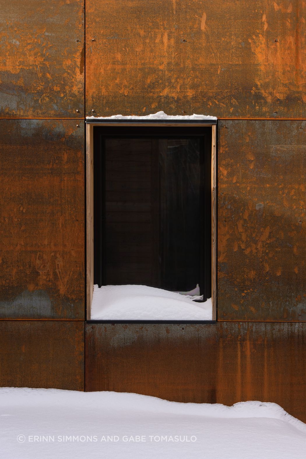 Corten clad connectors and a covered walkway mediate between these volumes and help resolve rooflines.